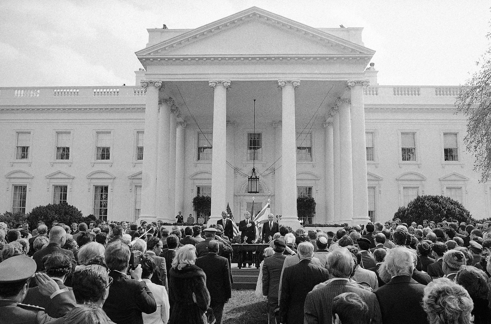 FILE - President Anwar Sadat of Egypt, U.S. President Jimmy Carter and Israeli Prime Minister Menachem Begin stand for the playing of their National Anthems at the White House in Washington, March 26, 1979, before the signing of the peace treaty between Israel and Egypt. (AP Photo, File)