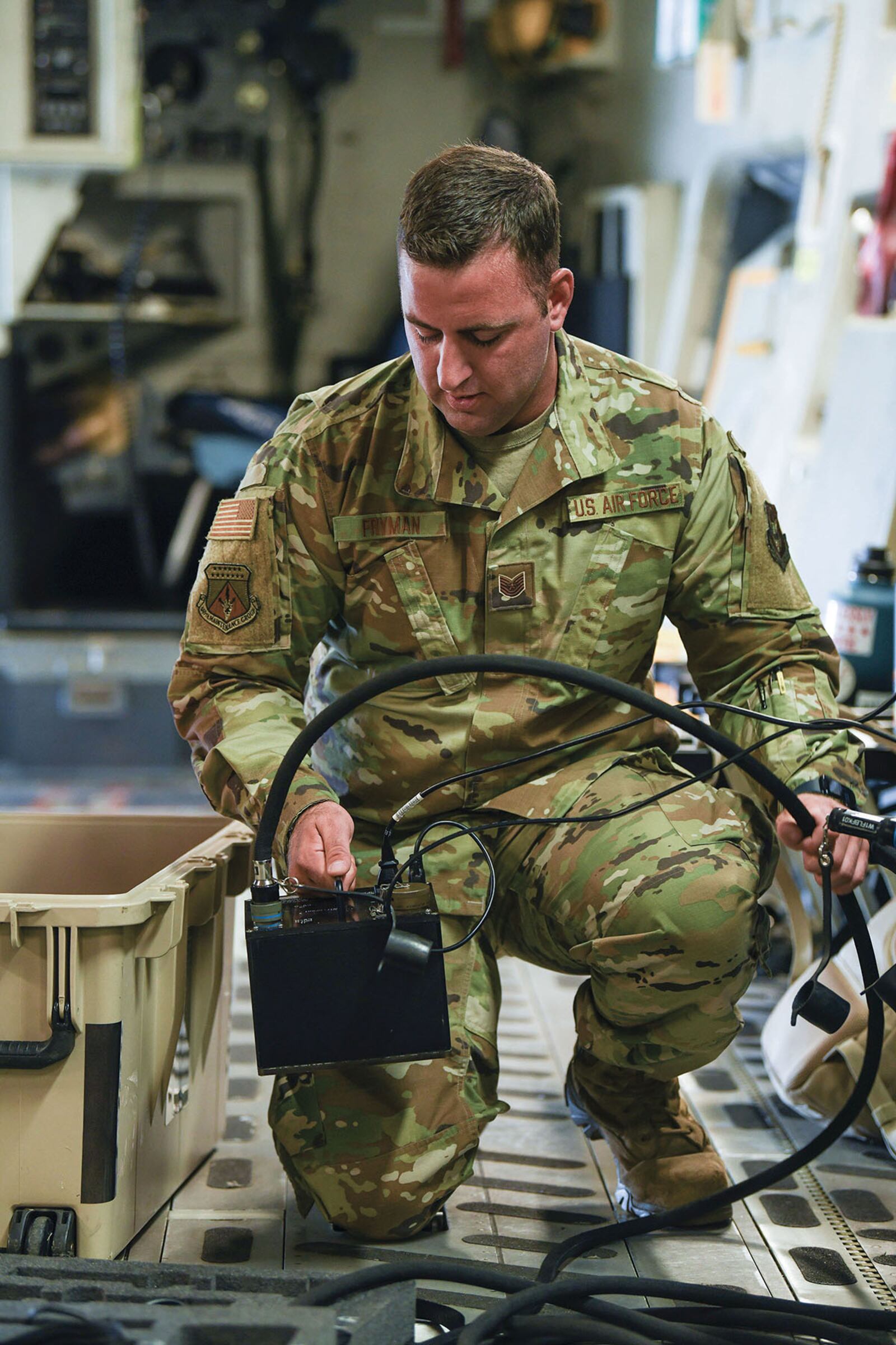 Tech. Sgt. Bradley Fryman, 445th Aircraft Maintenance Squadron communications and navigation technician, sets up systems equipment aboard a C-17 Globemaster III aircraft July 9. U.S. AIR FORCE PHOTO/MASTER SGT. PATRICK O’REILLY