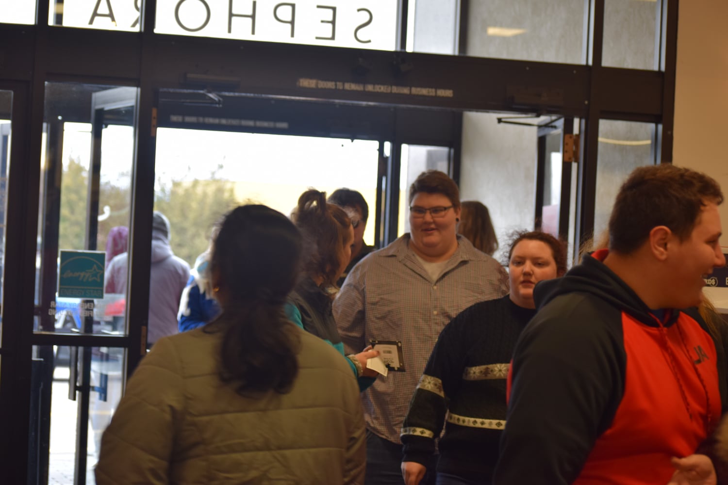 PHOTOS: Hundreds like up outside JCPenney for doorbusters, coupons