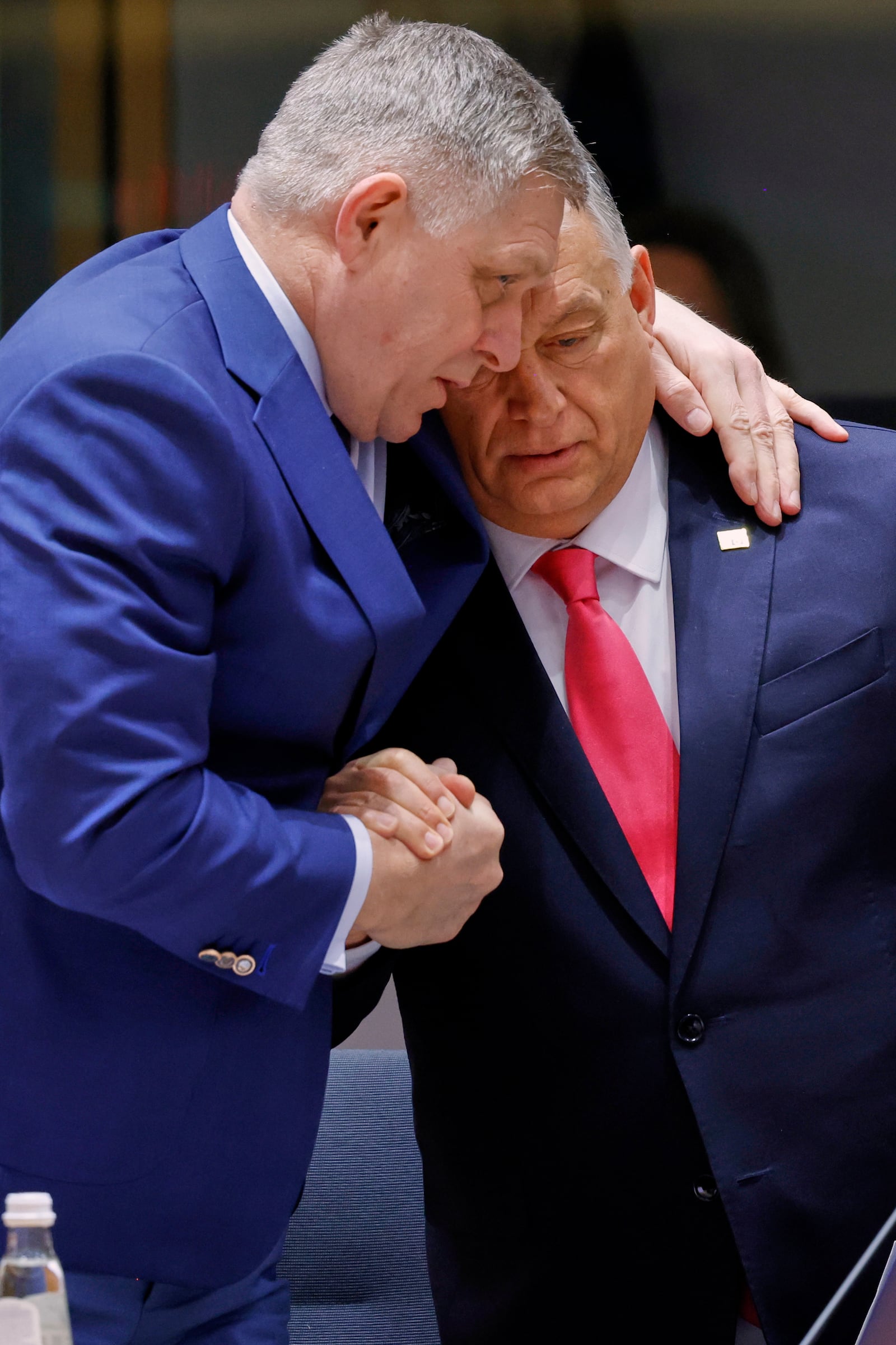 Slovakia's Prime Minister Robert Fico, left, speaks with Hungary's Prime Minister Viktor Orban during a round table meeting at an EU summit in Brussels, Thursday, March 20, 2025. (AP Photo/Omar Havana)