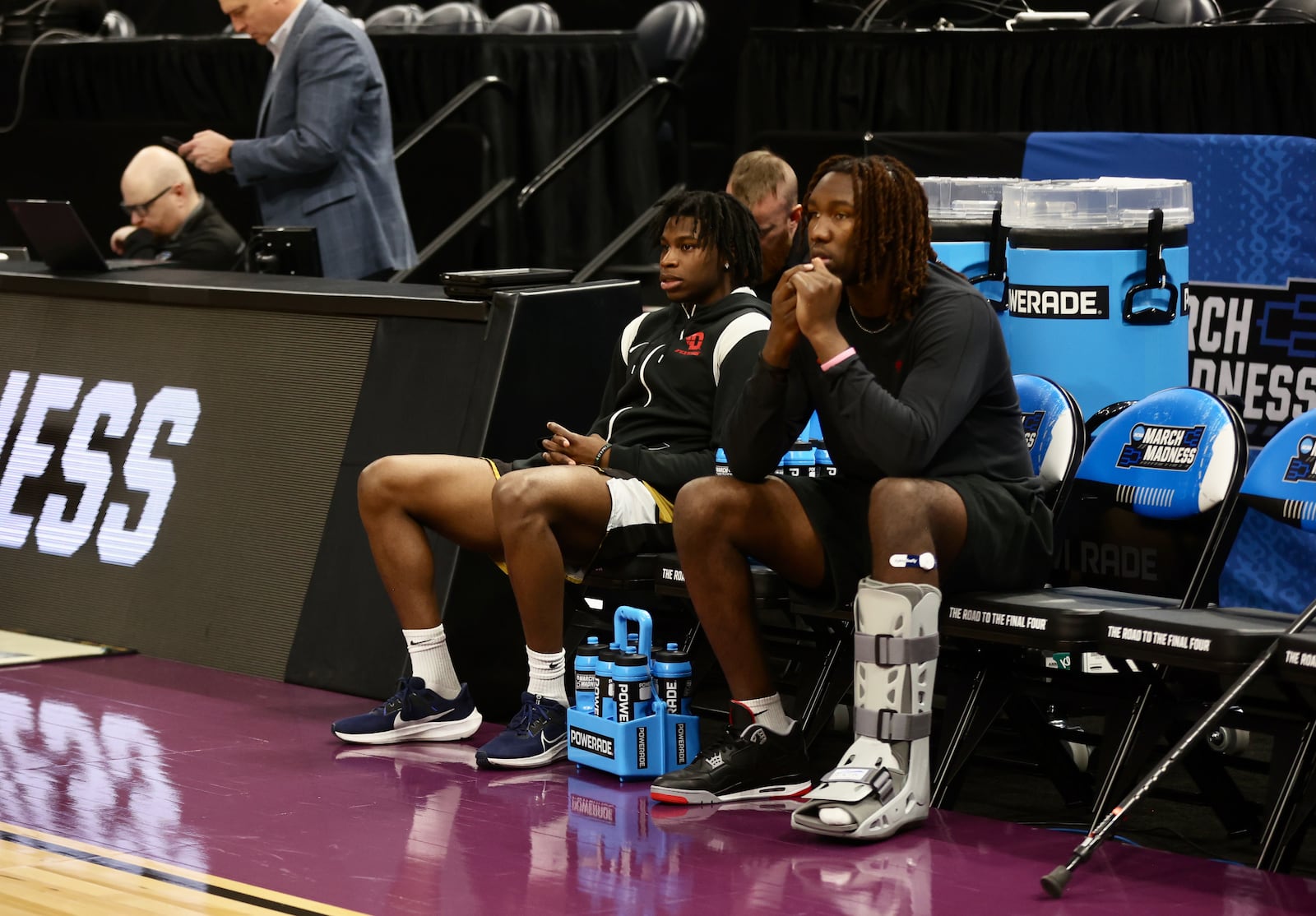 Dayton's Malachi Smith and Jaiun Simon watch the team practice for the NCAA tournament at the Delta Center in Salt Lake City, Utah, on Wednesday, March 20, 2024. David Jablonski/Staff