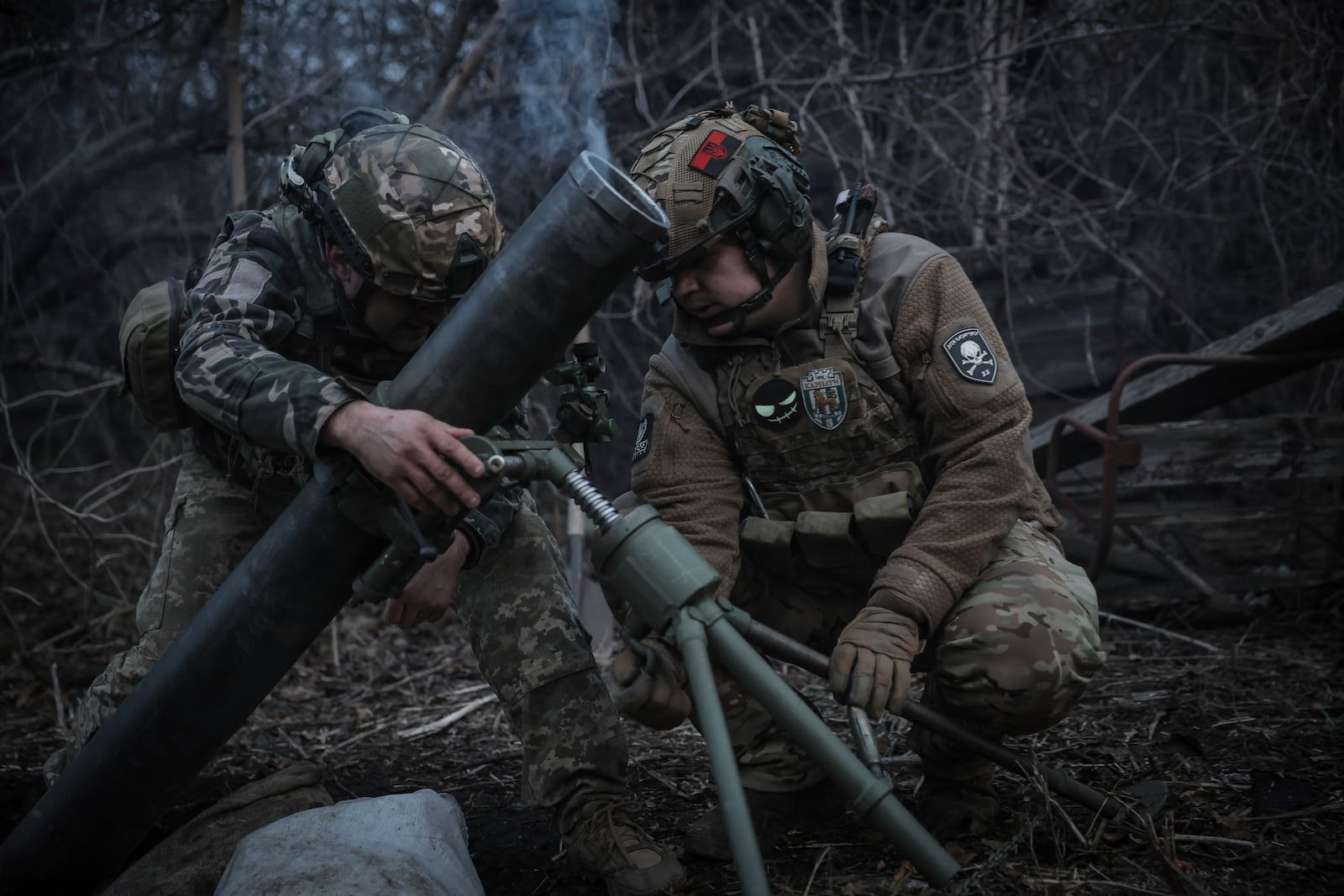 In this photo taken on March 16, 2025 and provided by Ukraine's 24th Mechanized Brigade press service, Ukrainian soldiers fire 120mm mortar towards Russian army positions near Chasiv Yar, Donetsk region, Ukraine, Sunday, March 16, 2025. (Oleg Petrasiuk/Ukraine's 24th Mechanized Brigade via AP)