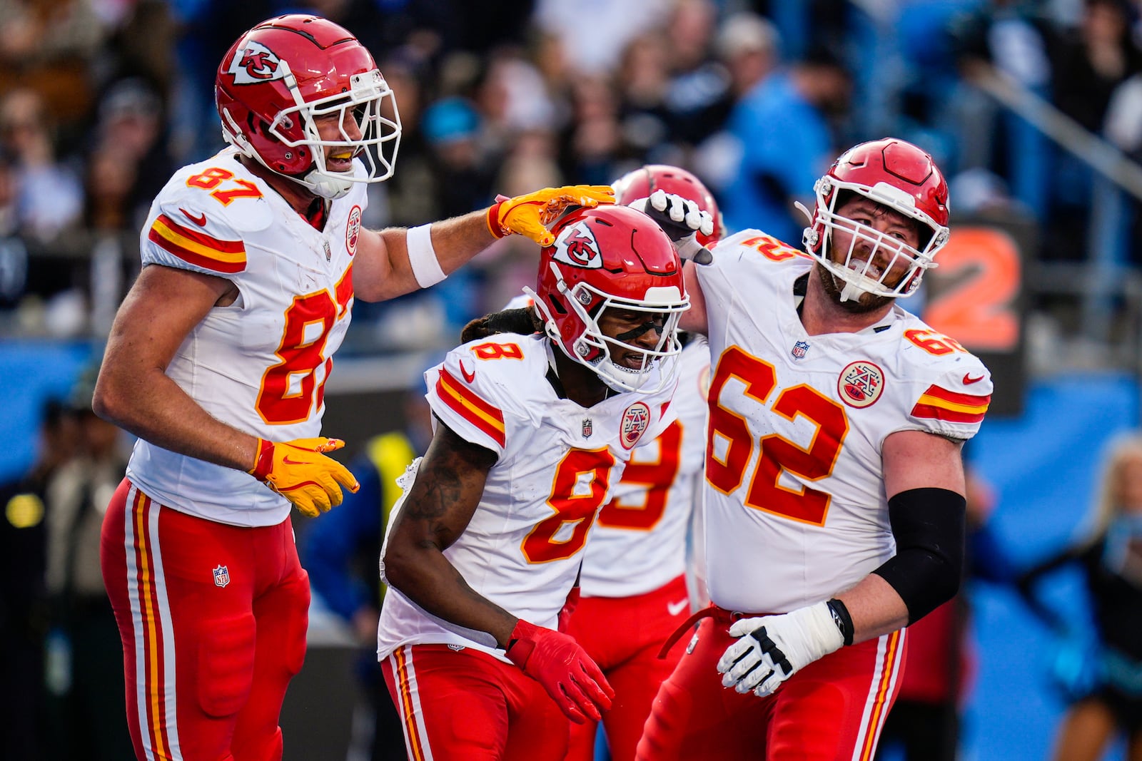 Kansas City Chiefs wide receiver DeAndre Hopkins (8) celebrates his touchdown catch with teammates during the second half of an NFL football game against the Carolina Panthers, Sunday, Nov. 24, 2024, in Charlotte, N.C. (AP Photo/Rusty Jones)