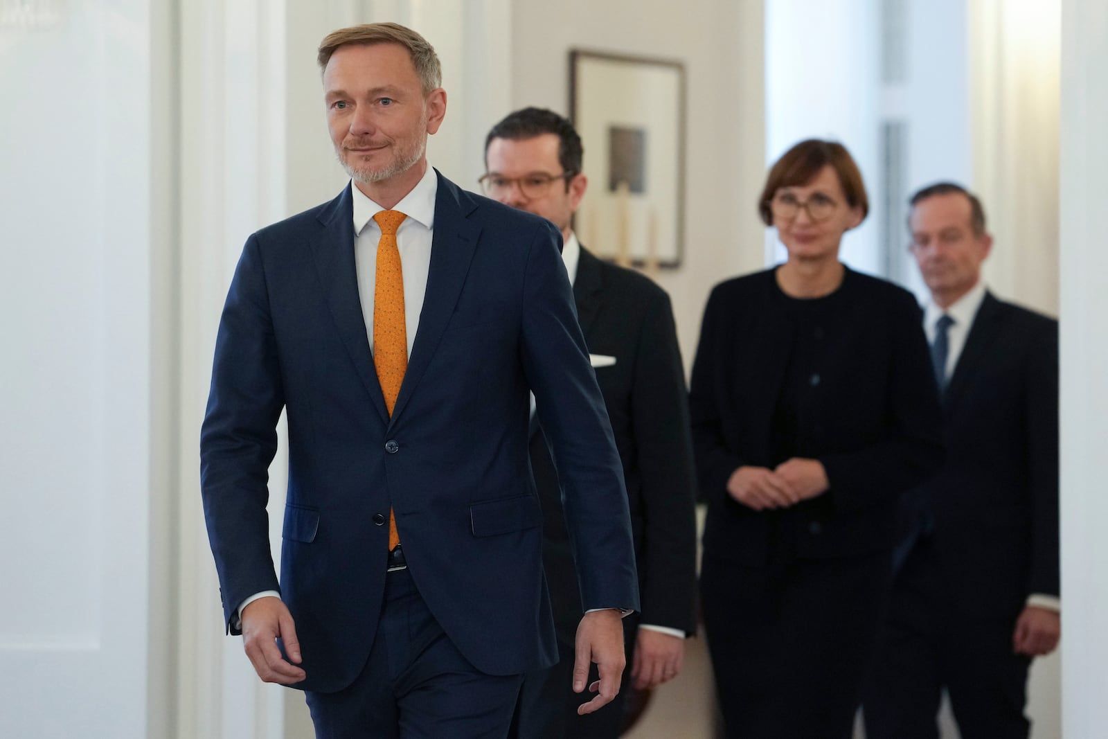 Christian Lindner Germany's former Federal Minister of Finance, Marco Buschmann, former Federal Minister of Justice, Bettina Stark-Watzinger, former Federal Minister of Education and Research, and Volker Wissing, Federal Minister of Digital Affairs and Transport, walk at Bellevue Palace, in Berlin, Thursday, Nov. 7, 2024. (Kay Nietfeld/dpa via AP)