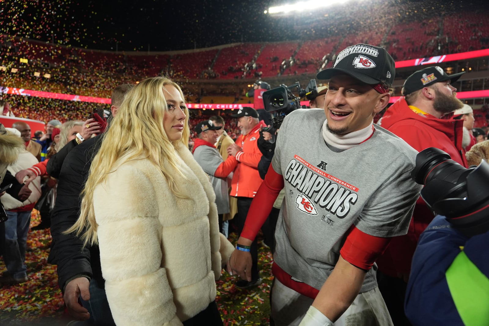 Kansas City Chiefs quarterback Patrick Mahomes celebrates with his wife, Brittany Mahomes, after the Chiefs defeated the Buffalo Bills in the AFC Championship NFL football game, Sunday, Jan. 26, 2025, in Kansas City, Mo. (AP Photo/Charlie Riedel)