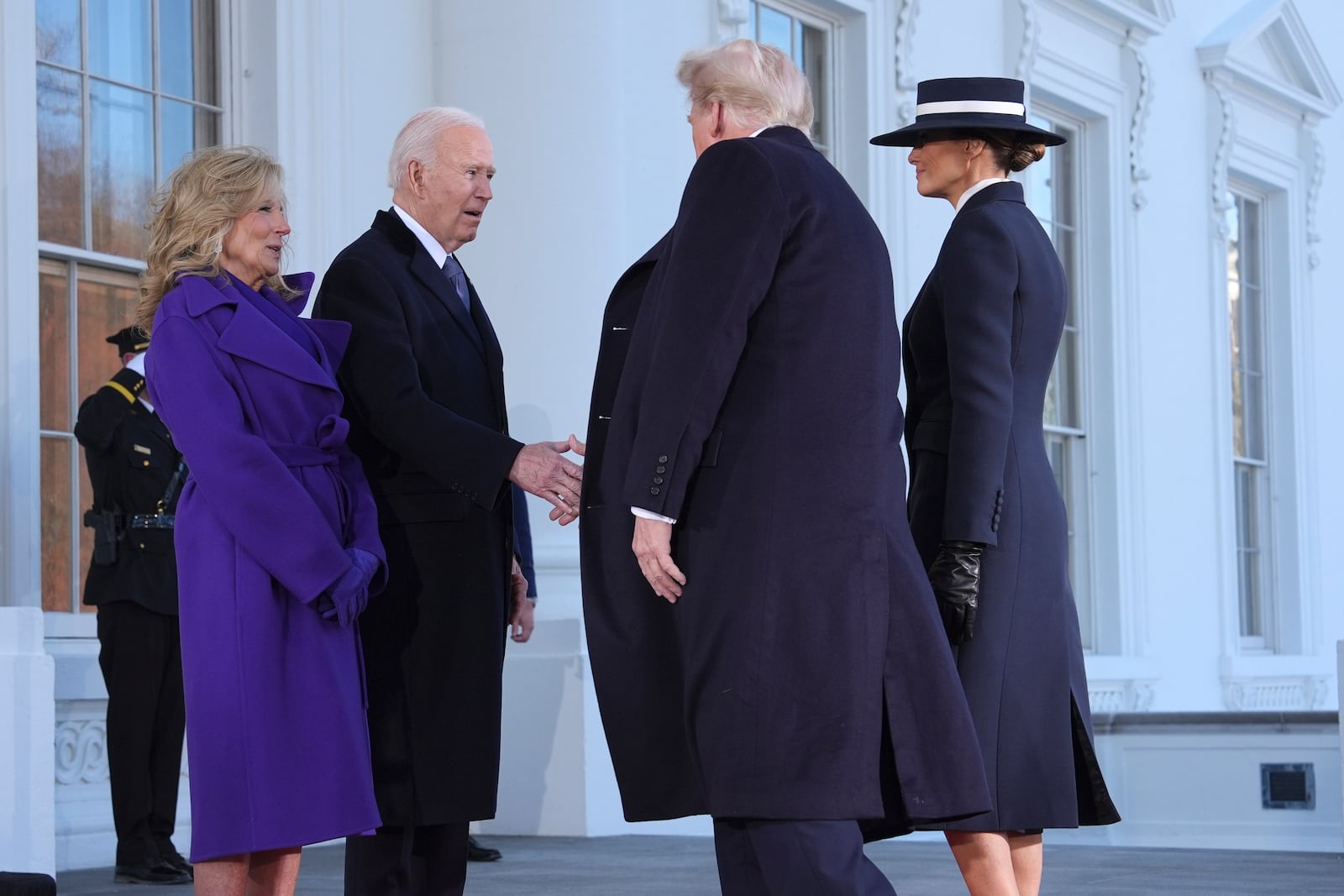 President Joe Biden, center left, and first lady Jill Biden, left, greet President-elect Donald Trump, center right, and Melania Trump, right, upon arriving at the White House, Monday, Jan. 20, 2025, in Washington. (AP Photo/Evan Vucci)