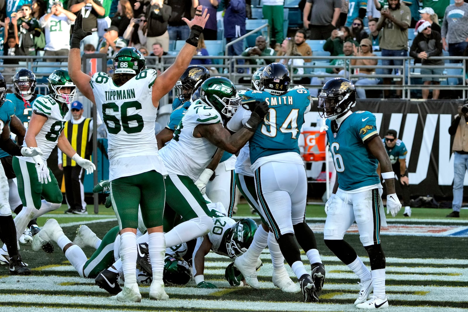 New York Jets running back Breece Hall (20) scores against the Jacksonville Jaguars on a 1-yard run during the second half of an NFL football game Sunday, Dec. 15, 2024, in Jacksonville, Fla. (AP Photo/John Raoux)