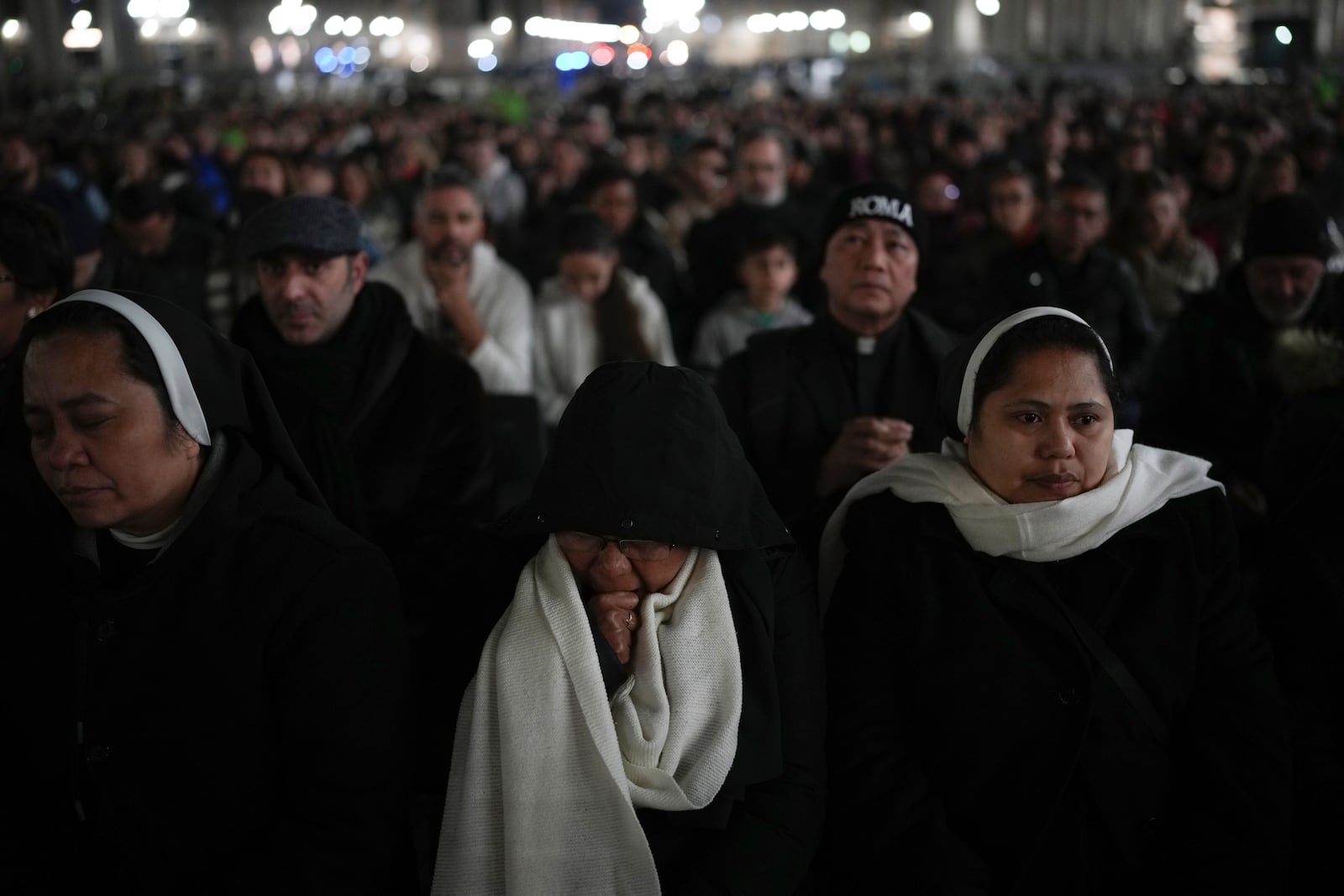 Nuns pray during a rosary prayer for Pope Francis' health in St. Peter's Square at the Vatican, Tuesday, March 4, 2025. (AP Photo/Alessandra Tarantino)