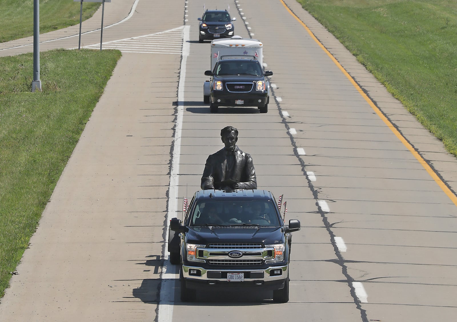 Abraham Lincoln went for a ride Tuesday morning, or at least a bronze statue of him did as sculptor Mike Major transported his latest creation from his studio in Urbana to Dayton. The sculpture was part of a convoy of motorcycles from the Southwest Gold Wing Riders Asoociation Chapter F and cars from the American Veterans Heritage Center. BILL LACKEY/STAFF