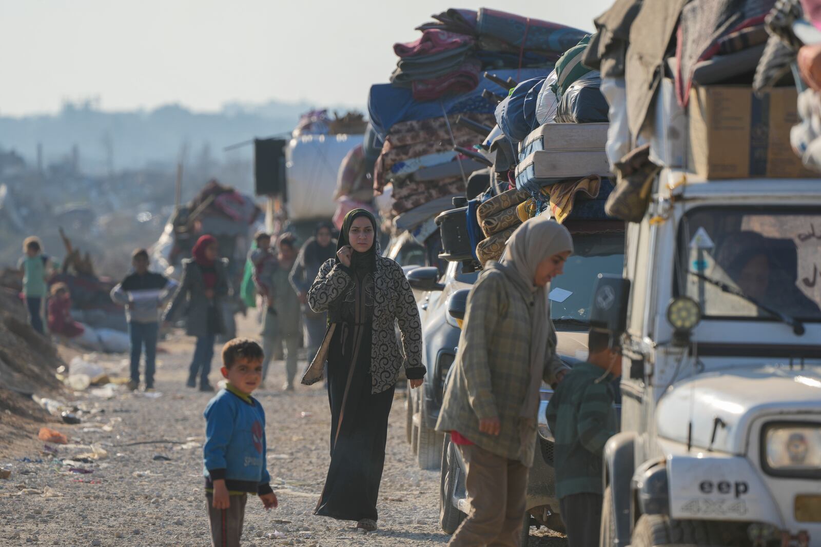 Displaced Palestinians make their way from central Gaza to their homes in the northern Gaza Strip, Wednesday, Jan. 29, 2025. after Israel began allowing hundreds of thousands of Palestinians to return as part of the ceasefire deal between Israel and Hamas. (AP Photo/Abdel Kareem Hana)