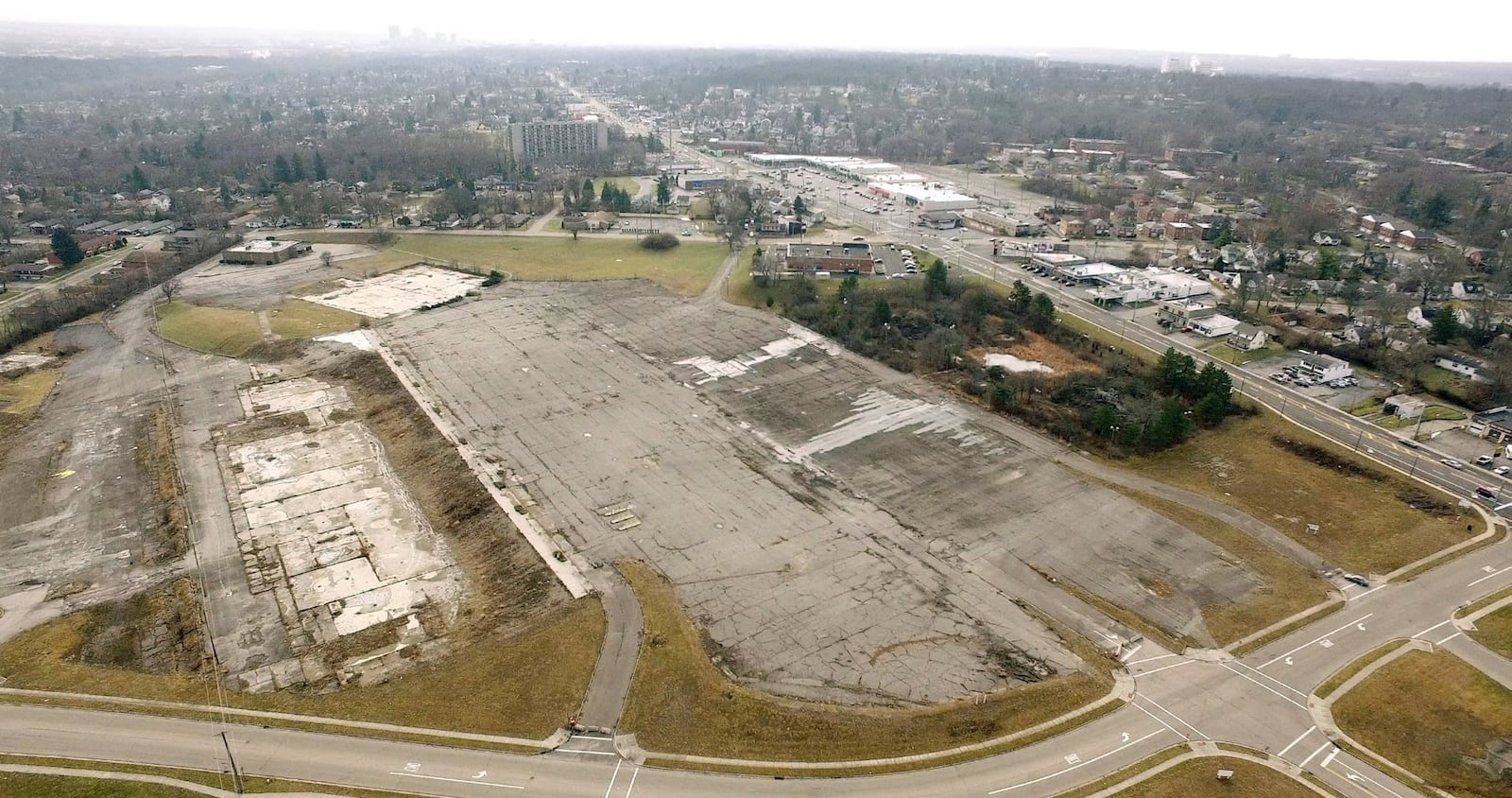 Outlines of retail building foundations and a parking lot are all that remains of the Forest Park shopping center on North Main Street in Harrison Township. County Corp, in partnership with Harrison Township and Montgomery County will facilitate the first public meeting to initiate feedback on the Forest Park Area Plan on Monday, January 29th at Horizon Science Academy. TY GREENLEES / STAFF