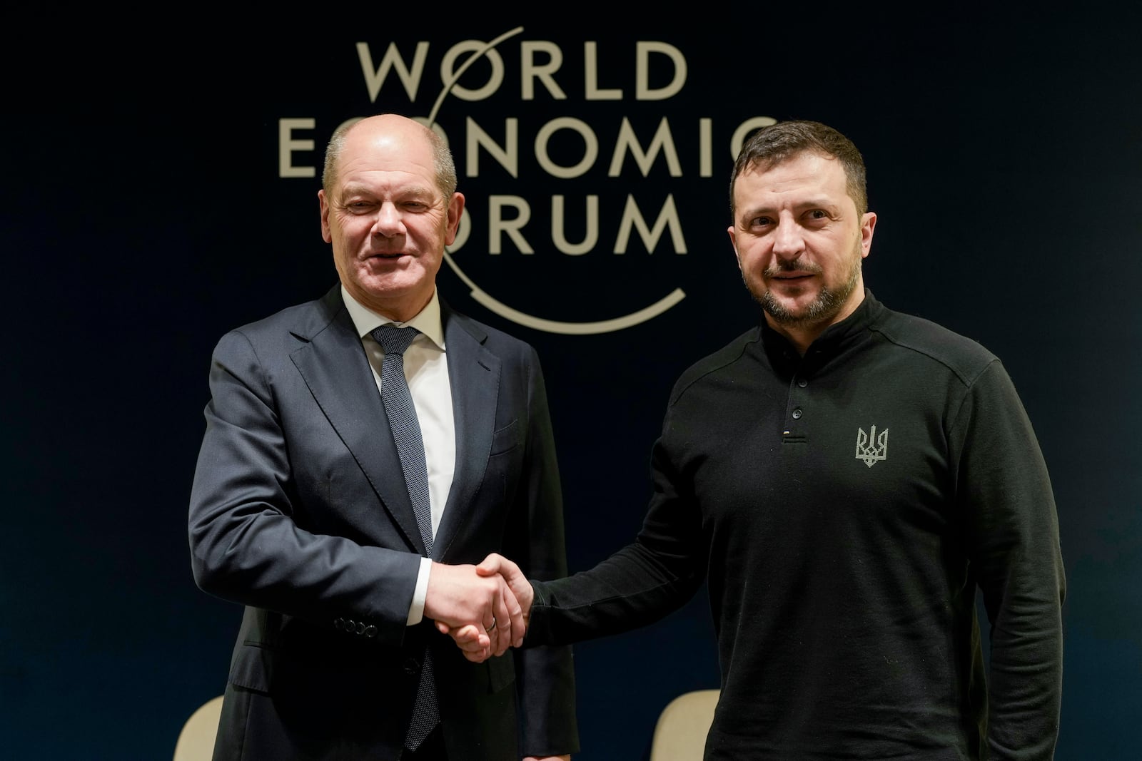 German Chancellor Olaf Scholz, left, and Ukrainian President Volodymyr Zelenskyy meet at the Annual Meeting of World Economic Forum in Davos, Switzerland, Tuesday, Jan. 21, 2025. (AP Photo/Markus Schreiber, Pool)