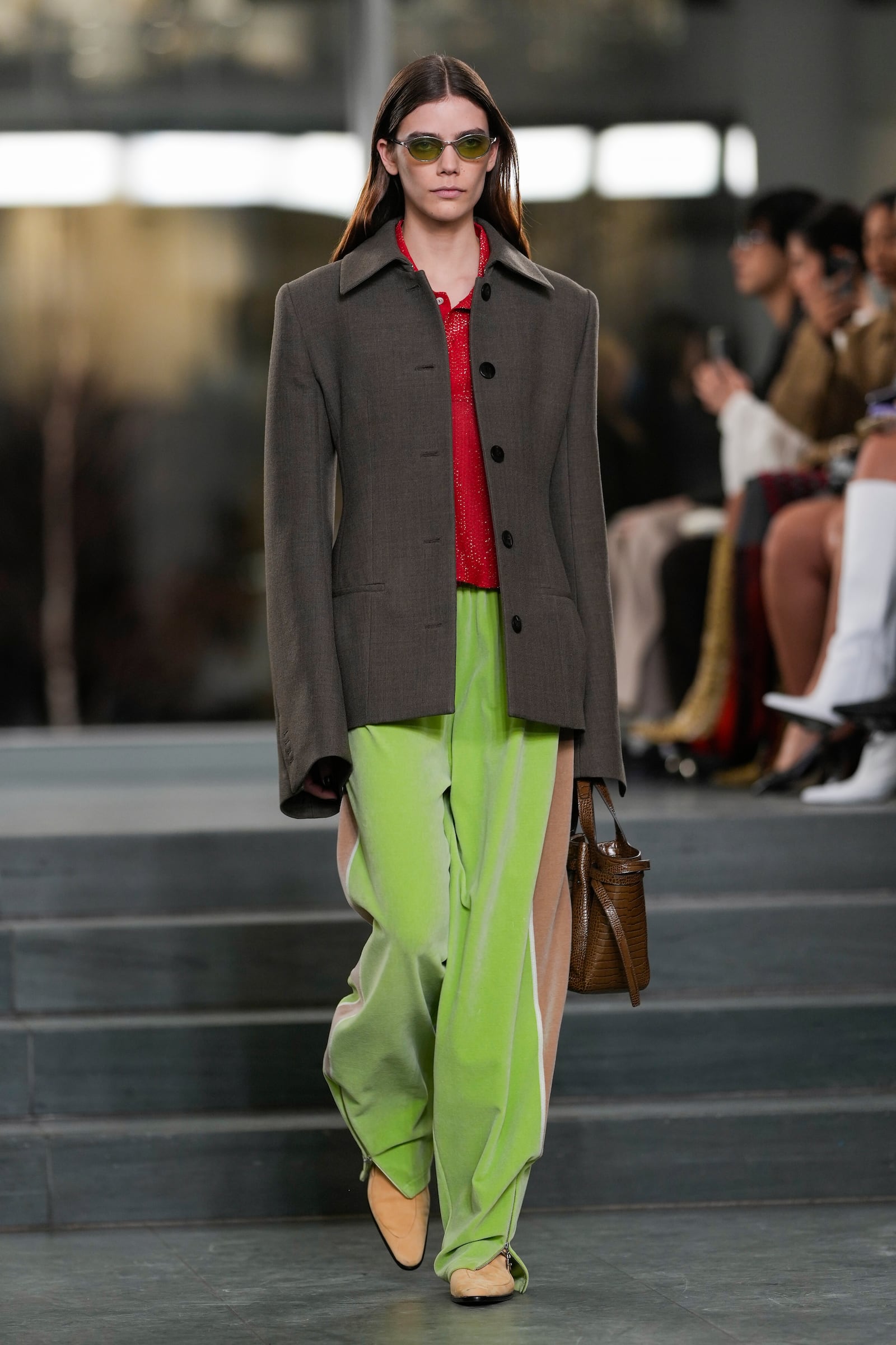 A model walks the runway during the Tory Burch Fall/Winter 2025 fashion show as part of New York Fashion Week on Monday, Feb. 10, 2025, at the Museum of Modern Art in New York. (Photo by Charles Sykes/Invision/AP)