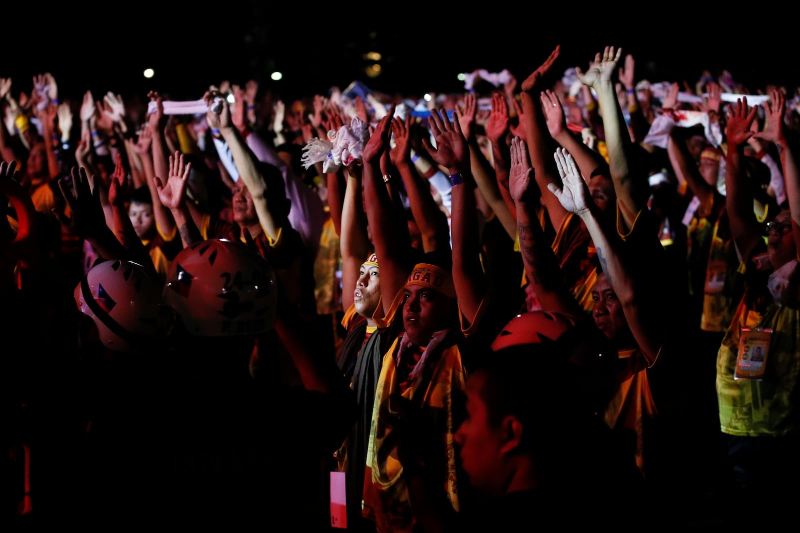 Devotees raise their hands as they join the annual procession of Jesus Nazareno in Manila, Philippines, Thursday. Jan. 9, 2025. (AP Photo/Basilio Sepe)