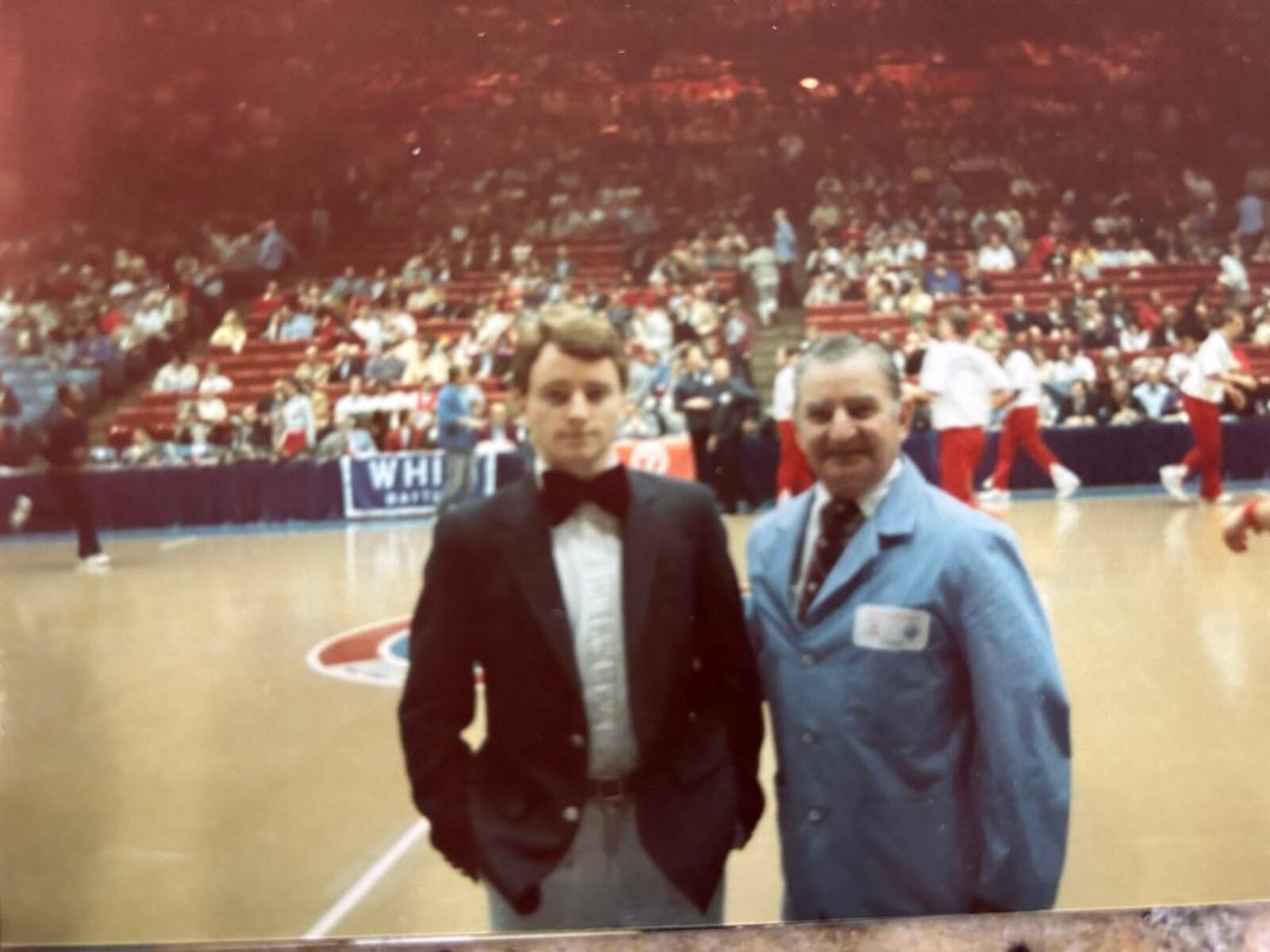 Flyers  student manager John Courtney on the UD Arena court  with his dad, Paul Courtney, for his last home game as a senior in 1985. CONTRIBUTED