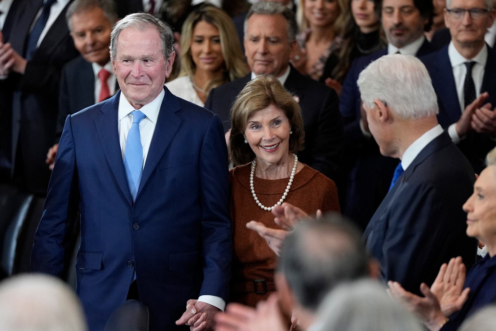 Former President George W. Bush and Laura Bush arrive as former President Bill Clinton watches before the 60th Presidential Inauguration in the Rotunda of the U.S. Capitol in Washington, Monday, Jan. 20, 2025. (AP Photo/Julia Demaree Nikhinson, Pool)