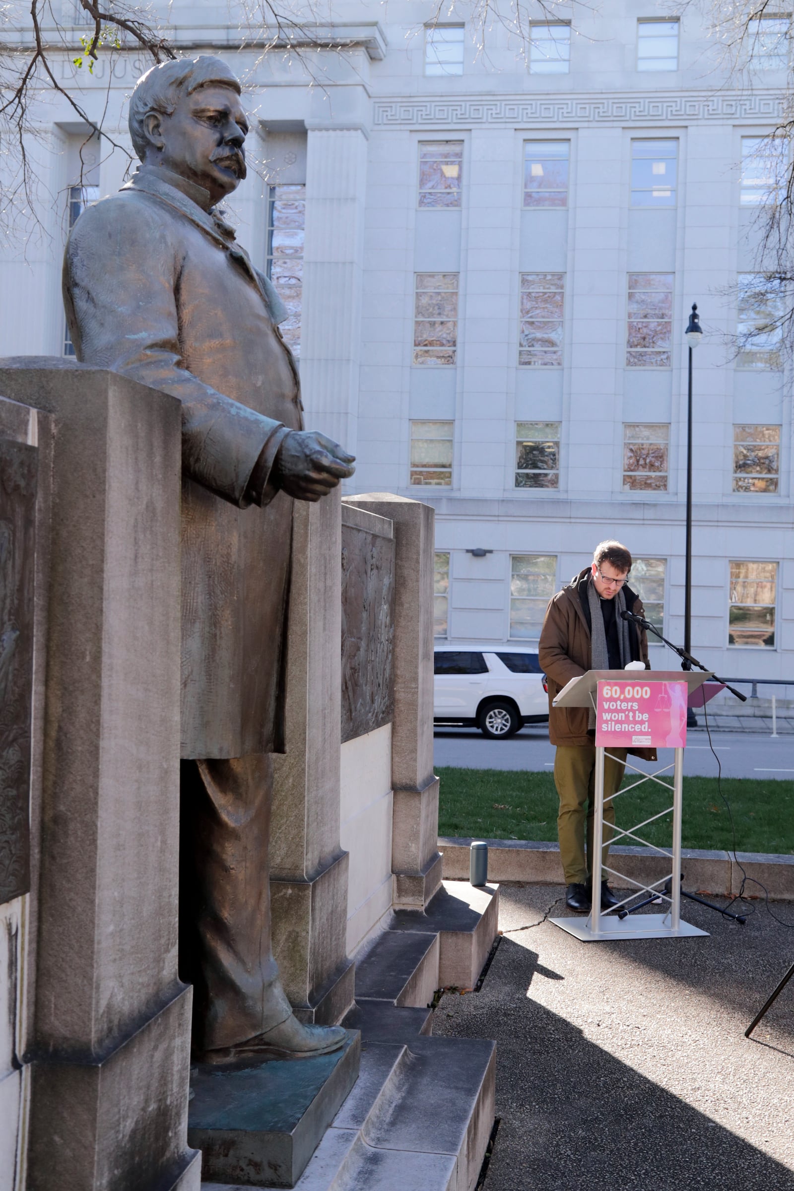 Ian McPherson reads names from a list of over 60,000 people who's Nov. 2024 election ballots have been challenged by Republican state Supreme Court candidate Jefferson Griffin in his extremely close race with Democratic Associate Justice Allison Riggs, Tuesday, Jan. 14, 2025, in Raleigh, N.C. (AP Photo/Chris Seward)