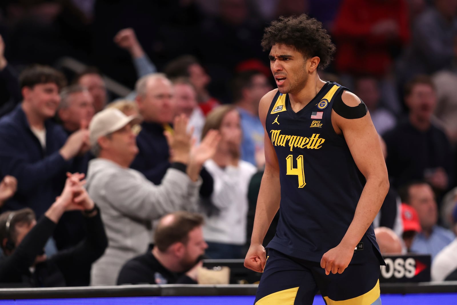 Marquette guard Stevie Mitchell (4) reacts after scoring during the second half of an NCAA college basketball game against Xavier in the quarterfinals of the Big East Conference tournament, Thursday, March 13, 2025, in New York. (AP Photo/Pamela Smith)