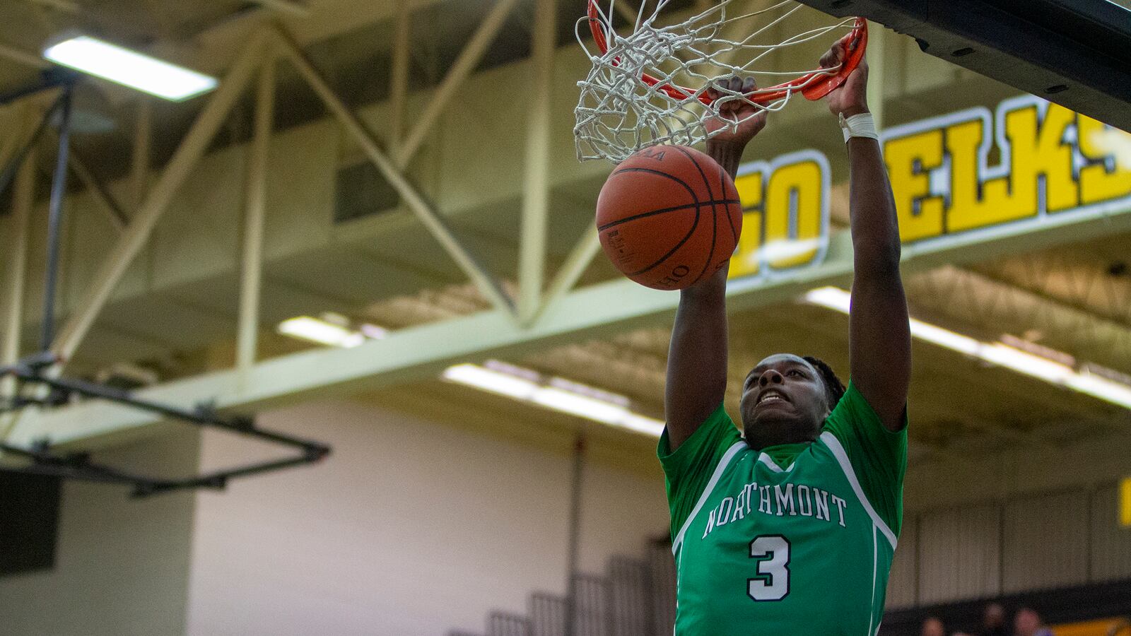 Northmont's Da'lin Wilkins dunks in the first half Tuesday night to help his team win and advance against Piqua. CONTRIBUTED/Jeff Gilbert