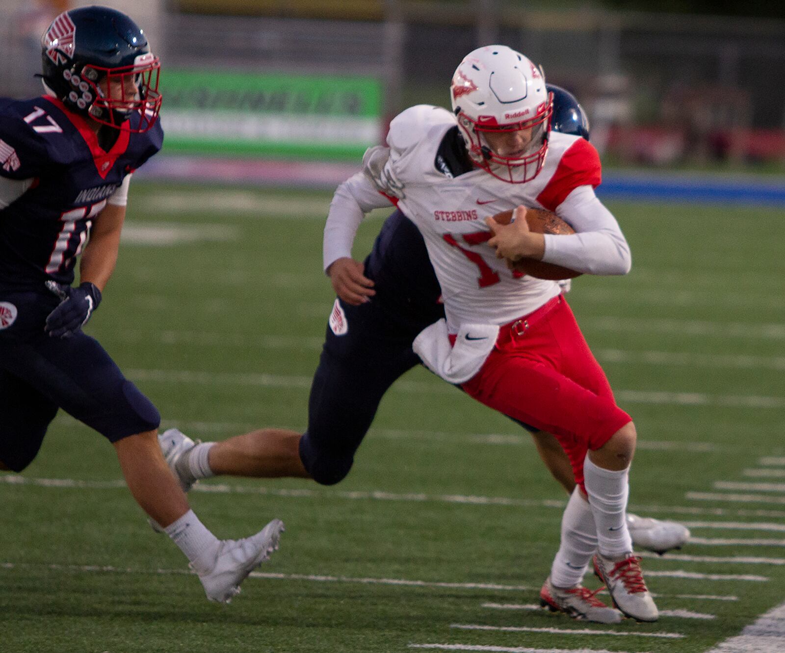 Stebbins quarterback Nate Keller fights for yardage against Piqua on Friday, Sept. 18, 2020. Jeff Gilbert/CONTRIBUTED