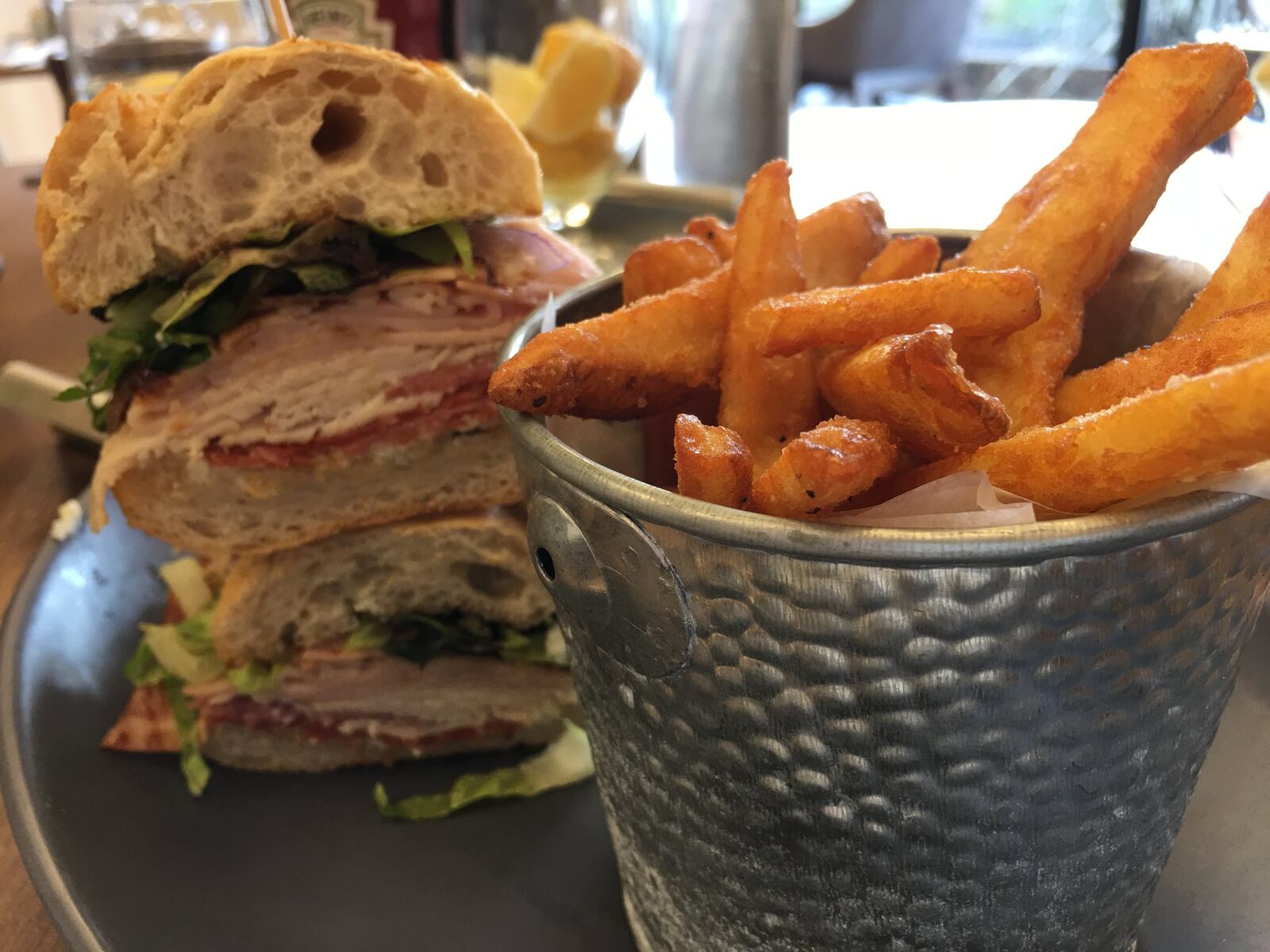 Dewberry 1850 sandwiches featured at lunch come with a fist full of beer batter fries and are piled high with ingredients. CONTRIBUTED PHOTO BY ALEXIS LARSEN