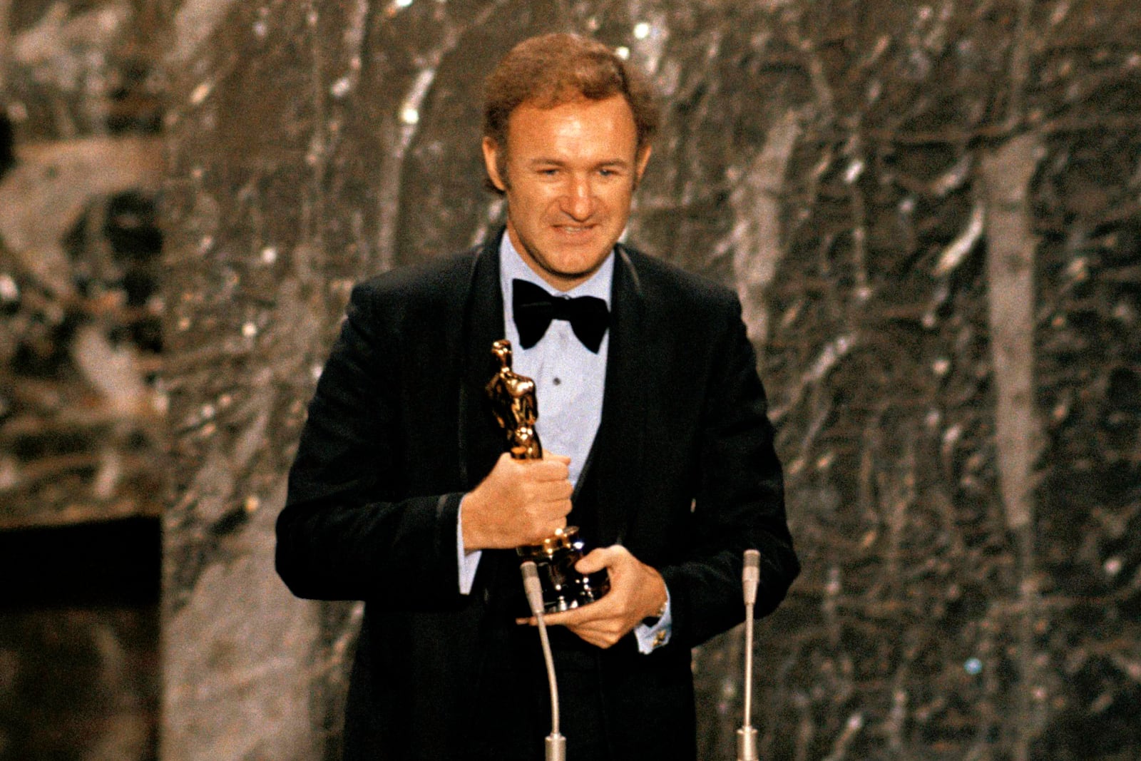 FILE - Gene Hackman accepts his Oscar for best actor at the 1971 Academy Awards in Los Angeles on April 10, 1972. (AP Photo, File)