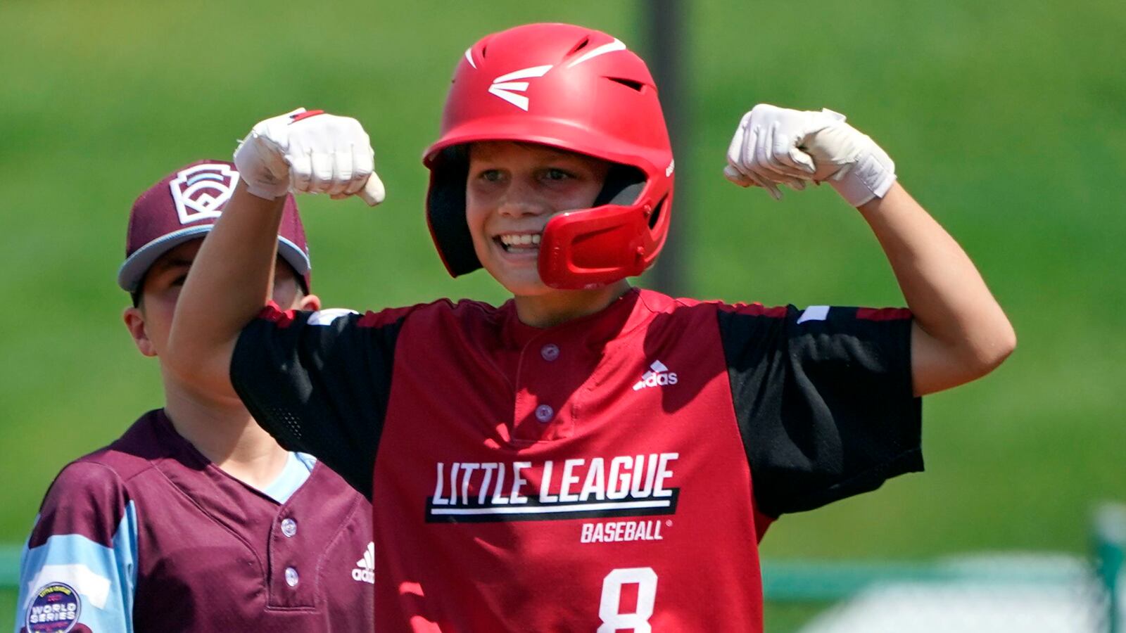 Hamilton, Ohio's Krew Brown (8) celebrates after hitting a double against Hooksett, N.H., during the third inning of a baseball game at the Little League World Series tournament in South Williamsport, Pa., Wednesday, Aug. 25, 2021. His won the game 4-3. (AP Photo/Tom E. Puskar)