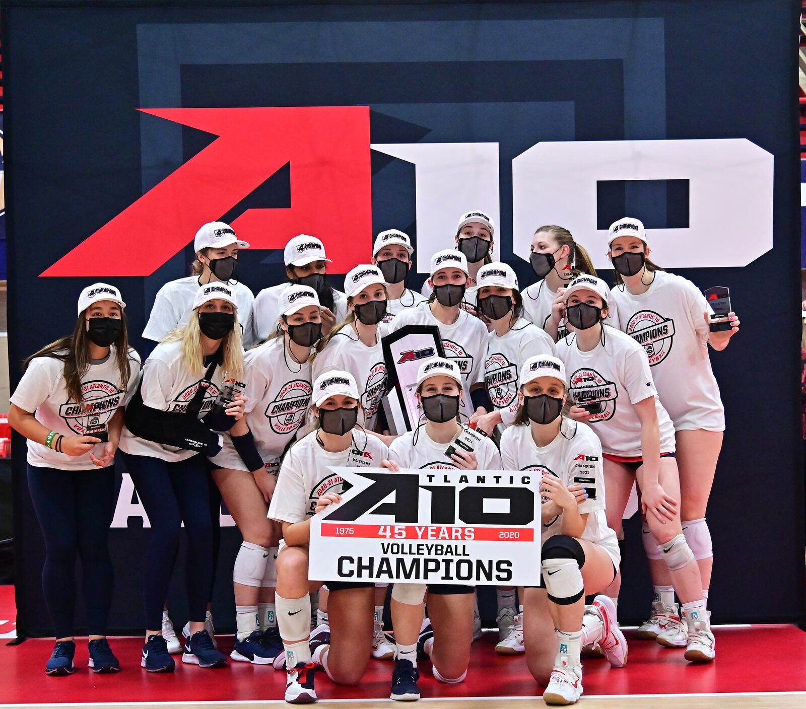 The Dayton Flyers celebrate after winning the Atlantic 10 Conference volleyball tournament championship on Saturday, April 3, 2021, at the Frericks Center. Photo by Erik Schelkun