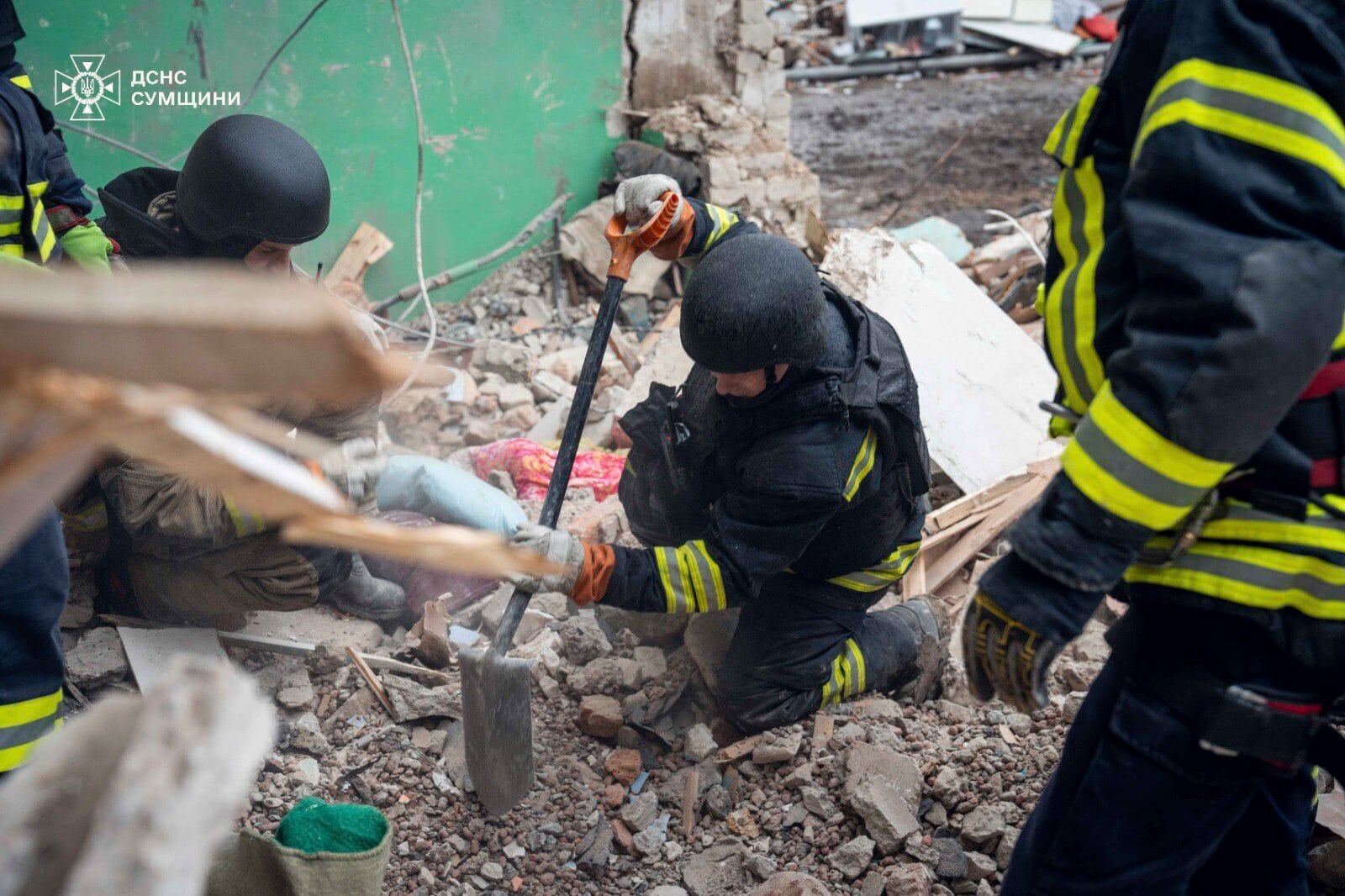 In this photo provided by the Ukrainian Emergency Services on Nov. 19, 2024, rescue workers clear the rubble of a residential building destroyed by a Russian strike in Hlukhiv, Ukraine. (Ukrainian Emergency Service via AP)