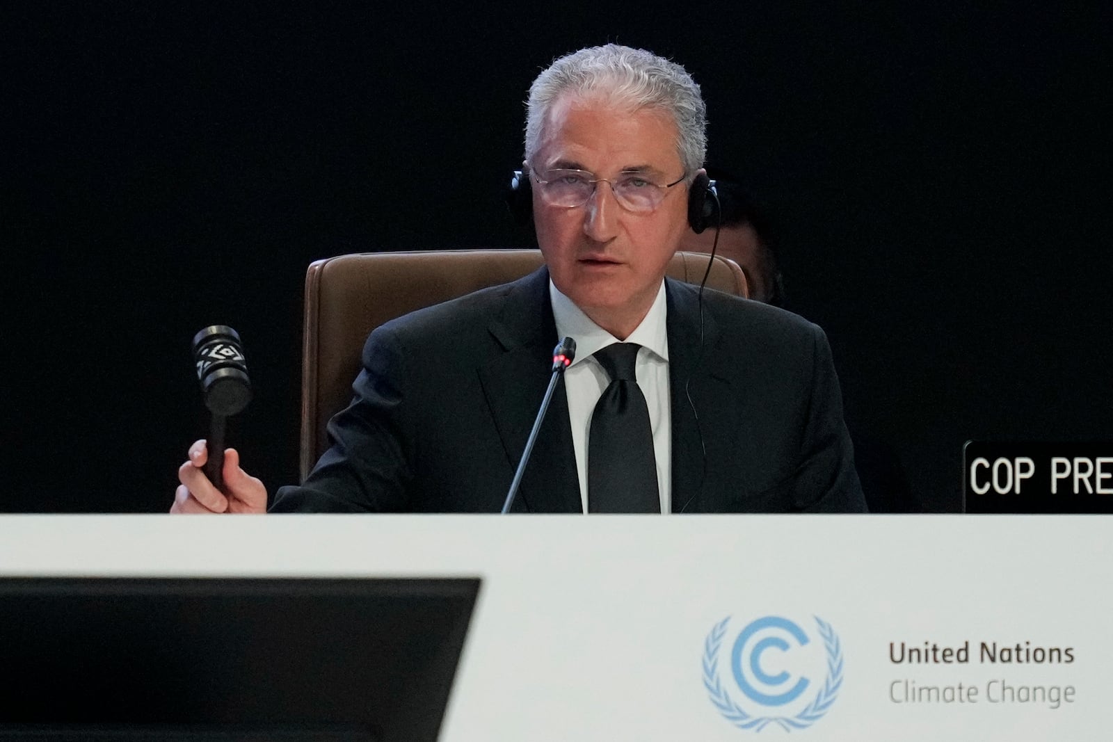 Mukhtar Babayev, COP29 President, bangs a gavel during a plenary session at the COP29 U.N. Climate Summit, Monday, Nov. 18, 2024, in Baku, Azerbaijan. (AP Photo/Rafiq Maqbool)