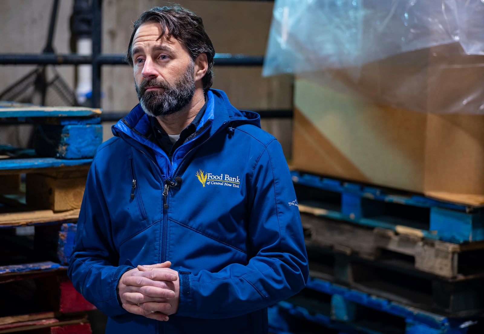 Brian McManus, Chief Operations Officer of the Food Bank of Central New York, comments about a massive donation effort that is underway as he stands near equipment for transporting salmon at Local Coho salmon fish farm, Friday, Jan. 24, 2025, in Auburn, N.Y. (AP Photo/Craig Ruttle)