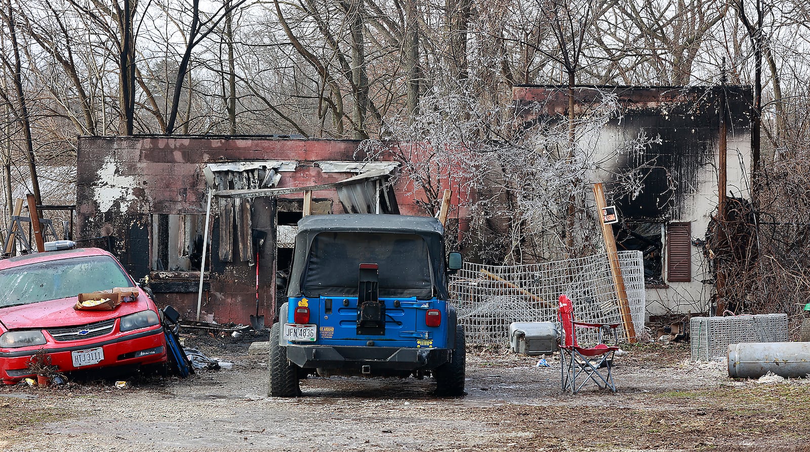 The charred remains of a house on Cherry Drive where several dogs were killed in a fire Sunday night. BILL LACKEY/STAFF