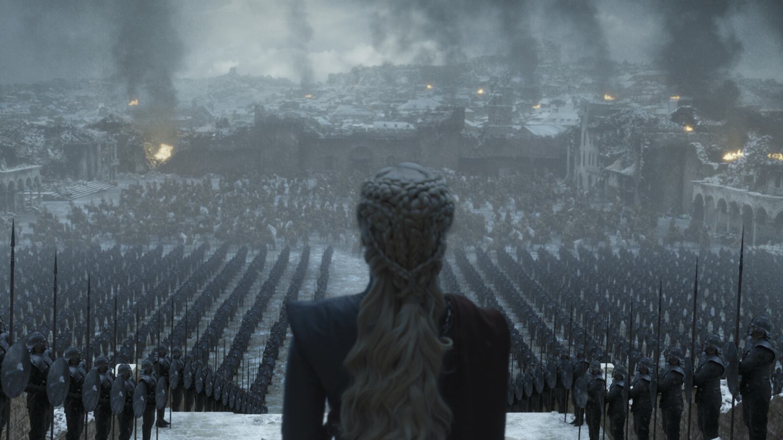 Daenerys Targaryen surveys her troops as what's left of Kings Landing smolders in this image from the final episode of "Game of Thrones."