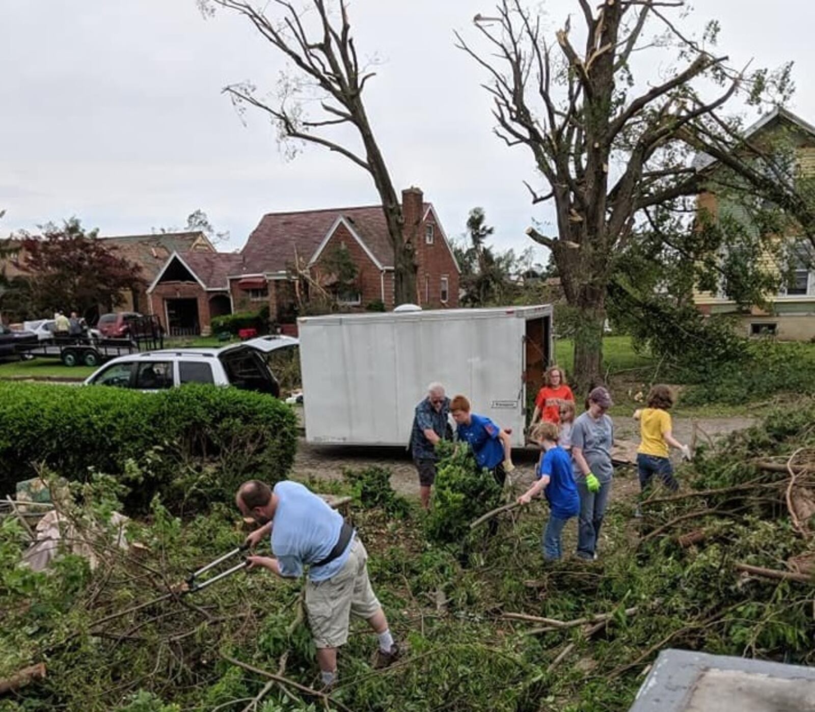 Friends and volunteers from the Oregon District worked to  clear Robin and Chris Sassenberg's Hillsdale Avenue home of debris.