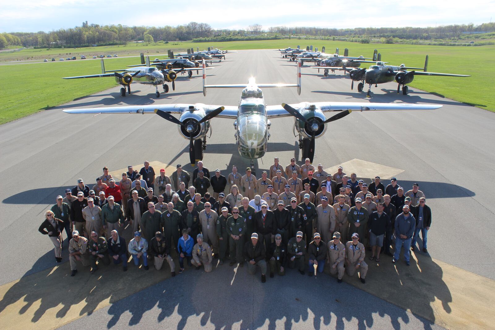 The crew members pose in front of the 11 World War II era B-25s that landed at the National Museum of the U.S. Air Force on Monday, April 17, 2017, to mark the 75th anniversary of the historic Doolittle Raiders attack against Japan. CHUCK HAMLIN / STAFF