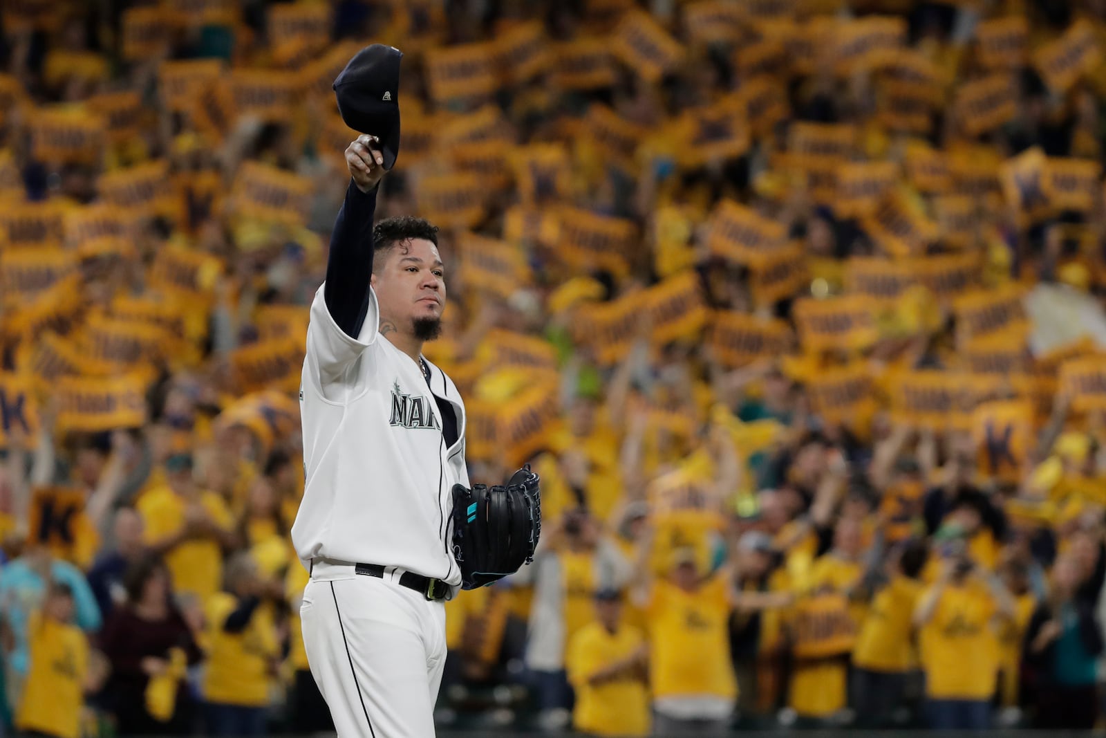 FILE - With the "King's Court" cheering section behind him, Seattle Mariners starting pitcher Félix Hernández tips his cap as he takes the mound for the team's baseball game against the Oakland Athletics, Sept. 26, 2019, in Seattle. (AP Photo/Ted S. Warren, File)