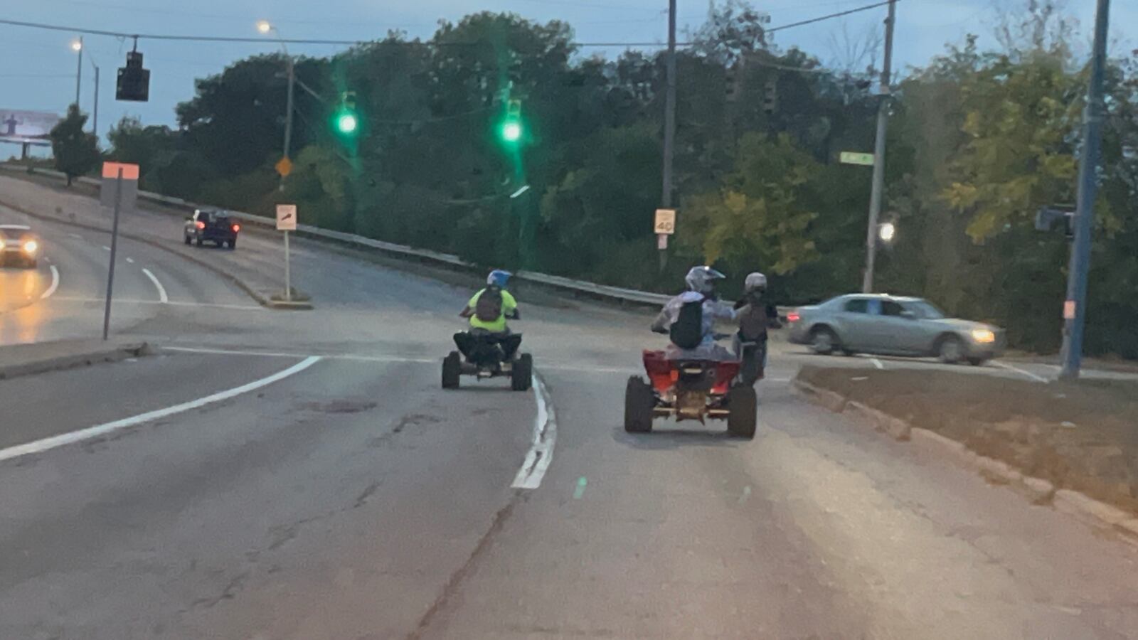 A couple of ATVs and a dirt bike ride north on Stanley Avenue near Troy Street on Wednesday, Oct. 4, 2023. The riders popped wheelies near Valley Street. CORNELIUS FROLIK / STAFF