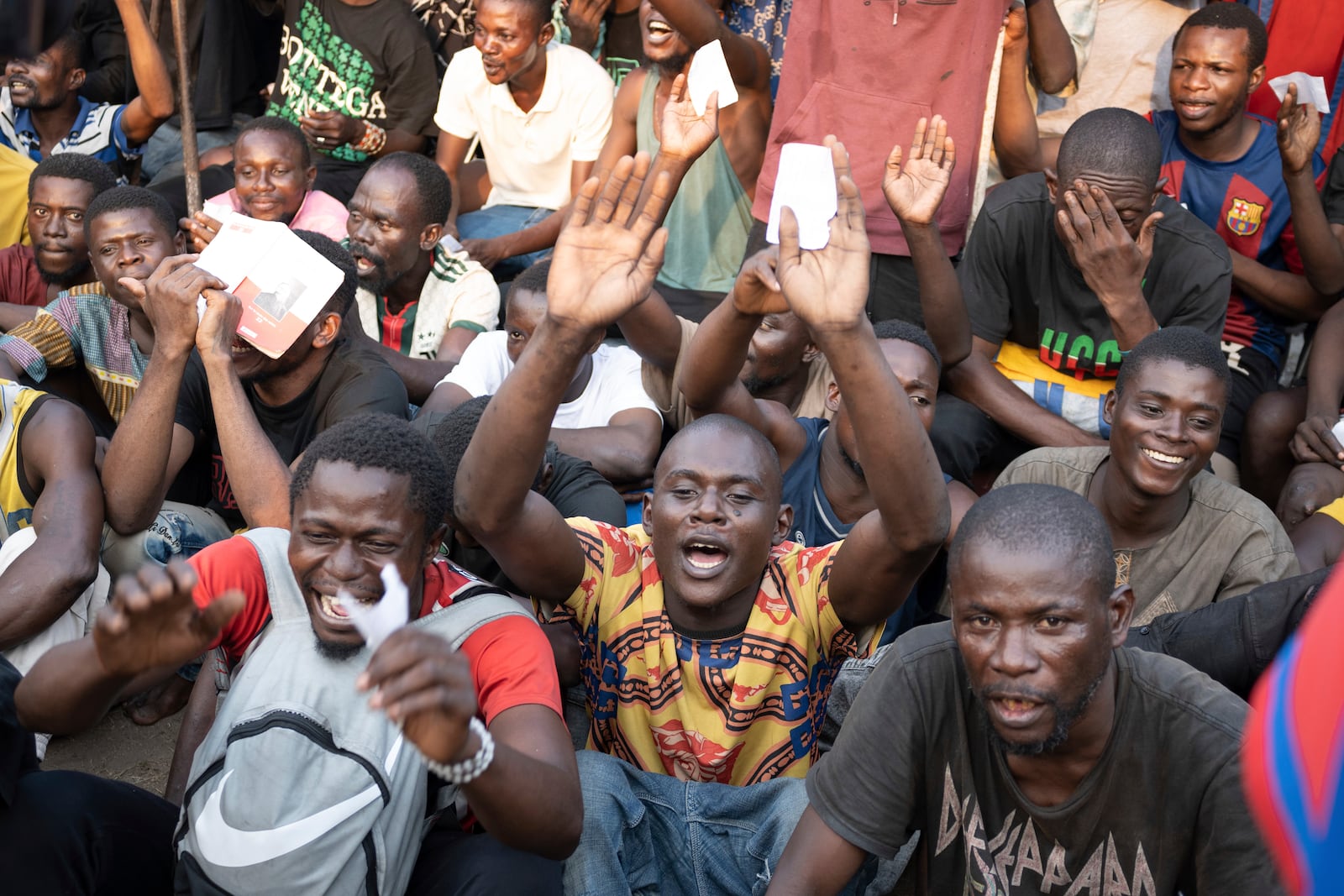 Some of the 600 prisoners released from Democratic Republic of the Congo's capital Kinshasa's Makala Central Prison react Saturday, Sept. 21, 2024. (AP Photo/Samy Ntumba Shambuyi)