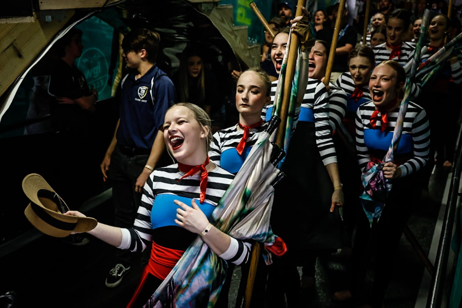 Miamisburg High School color guard team member, Kaiya McCurray screams for her teammates to get ready to perform at the WGI Color Guard World Championships round 2 at UD Arena Thursday April 13, 2023. JIM NOELKER/STAFF