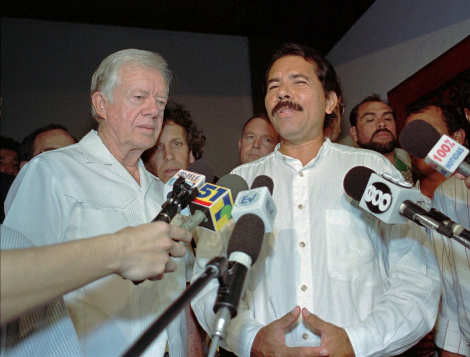 FILE - Former U.S. President Jimmy Carter, left, meets with Nicaraguan presidential candidate Daniel Ortega, of the Sandinista National Liberation Front, Oct. 19, 1996, in Managua, Nicaragua. (AP Photo/Brennan Linsley, File)