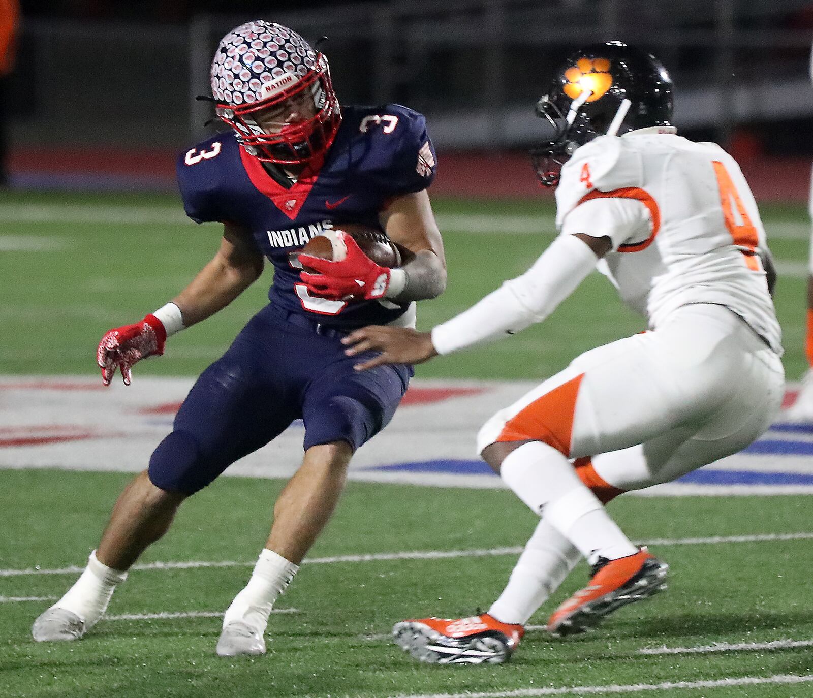 Jasiah Medley tries to avoid Withrow's Damone Thomas during a Division II, Region 8 playoff game on Nov. 5, 2021. BILL LACKEY/STAFF