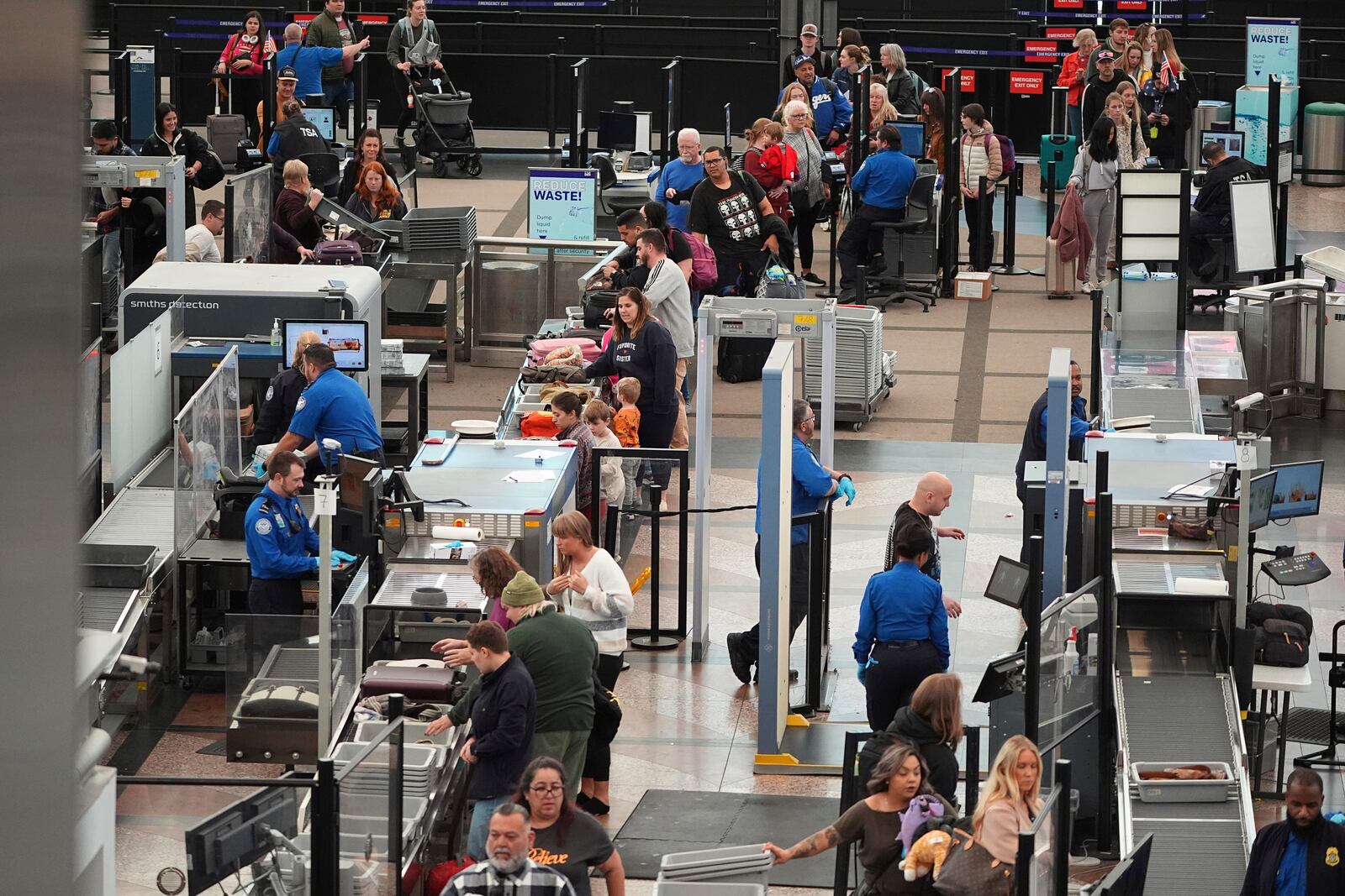 Travellers pass through the south security checkpoint in Denver International Airport Tuesday, Nov. 26, 2024, in Denver. (AP Photo/David Zalubowski)