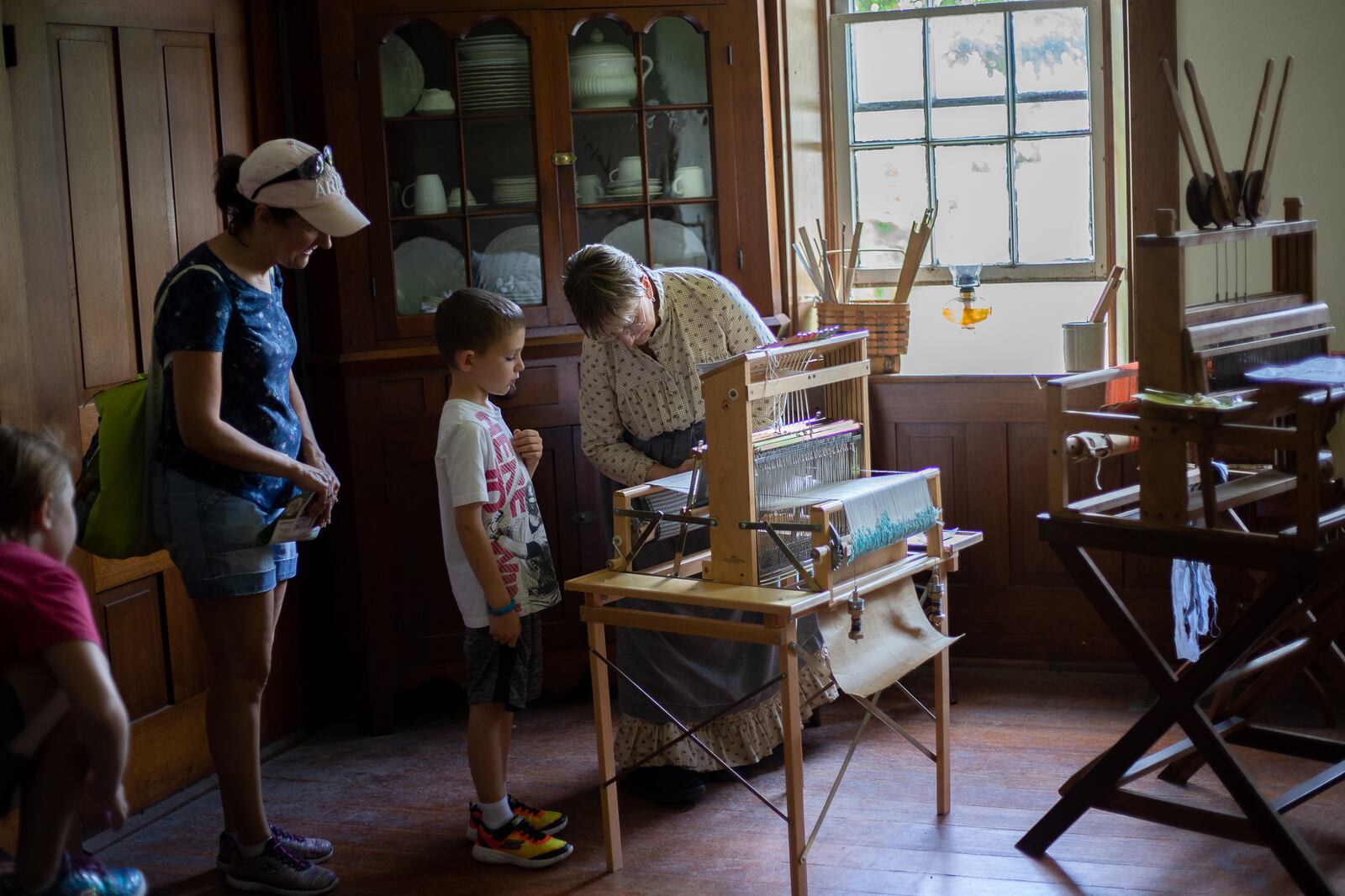 Participants enjoying a live historic demonstration at Small Farm and Food Fest.