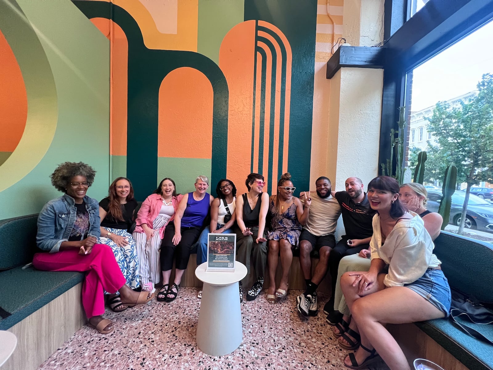 A Lore Storytelling reunion event held at Joui Wine in downtown Dayton. The cohorts consist of 6-8 individuals learning to craft and present their stories. Te'Jal Cartwright, owner of Lore, partners with local small businesses for these "graduations".