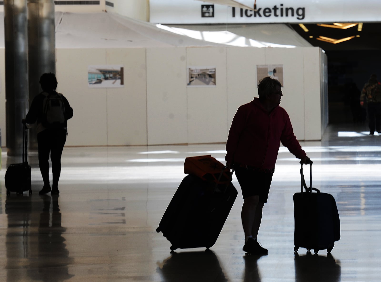 Travelers were making their way through the Dayton International Airport Thursday, Oct. 20, 2022. Prices at area airports have risen over the last year, according to federal data, and experts say that people who plan to travel during the upcoming holidays should buy their tickets as soon as possible. MARSHALL GORBY\STAFF