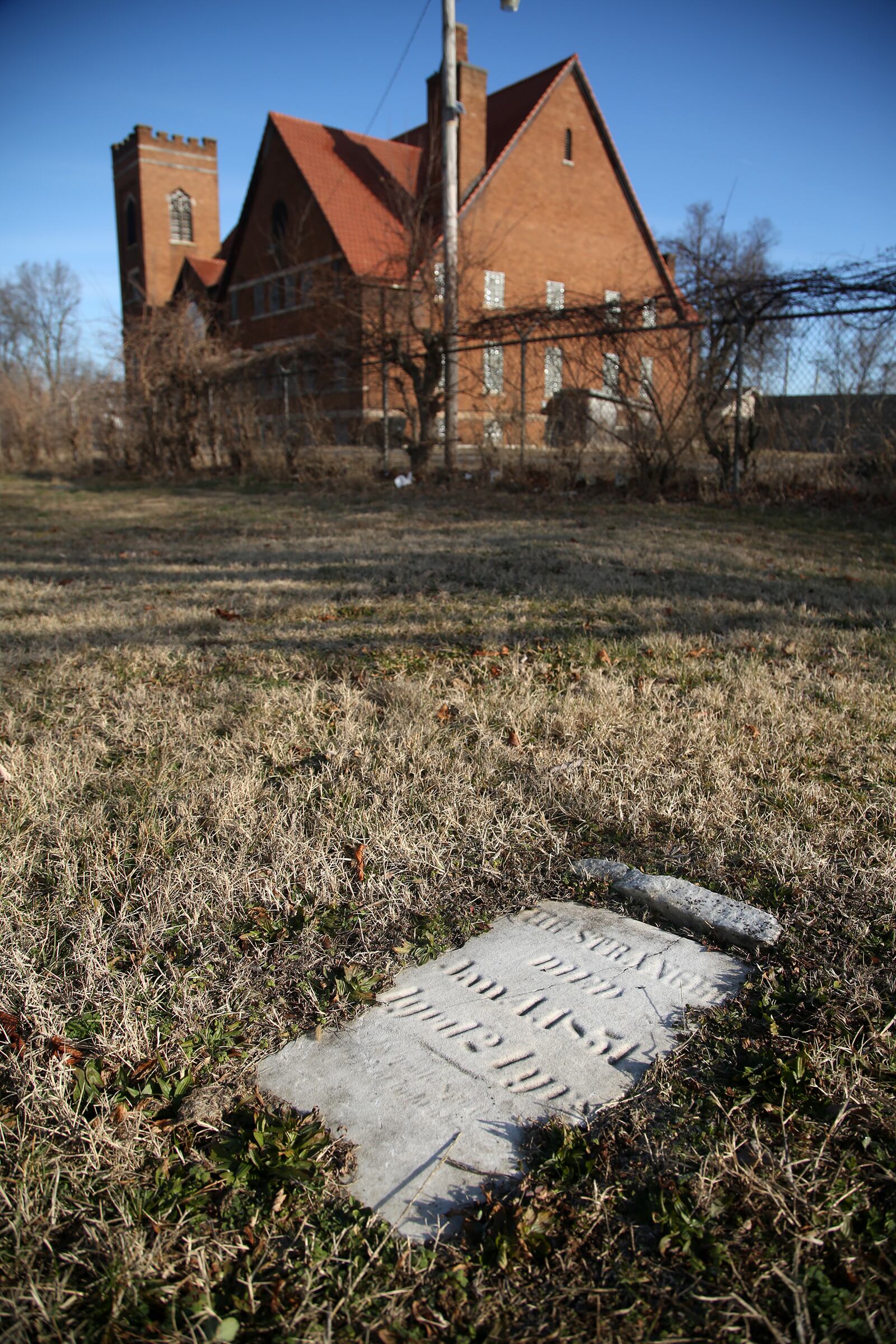 A tombstone labeled “THE STRANGER” marks the grave of a young woman buried at Old Greencastle Cemetery in Dayton. LISA POWELL / STAFF