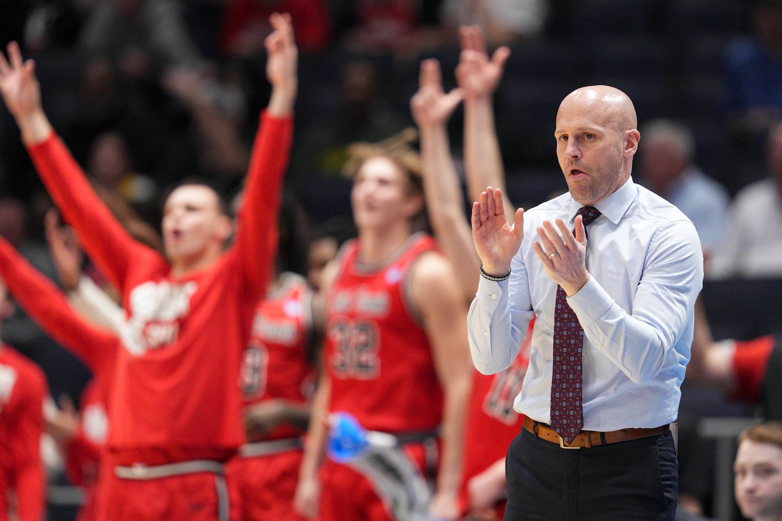 Saint Francis head coach Rob Krimmel, right, reacts to a three-point basket during the first half of a First Four college basketball game against Alabama State in the NCAA Tournament, Tuesday, March 18, 2025, in Dayton, Ohio. (AP Photo/Jeff Dean)