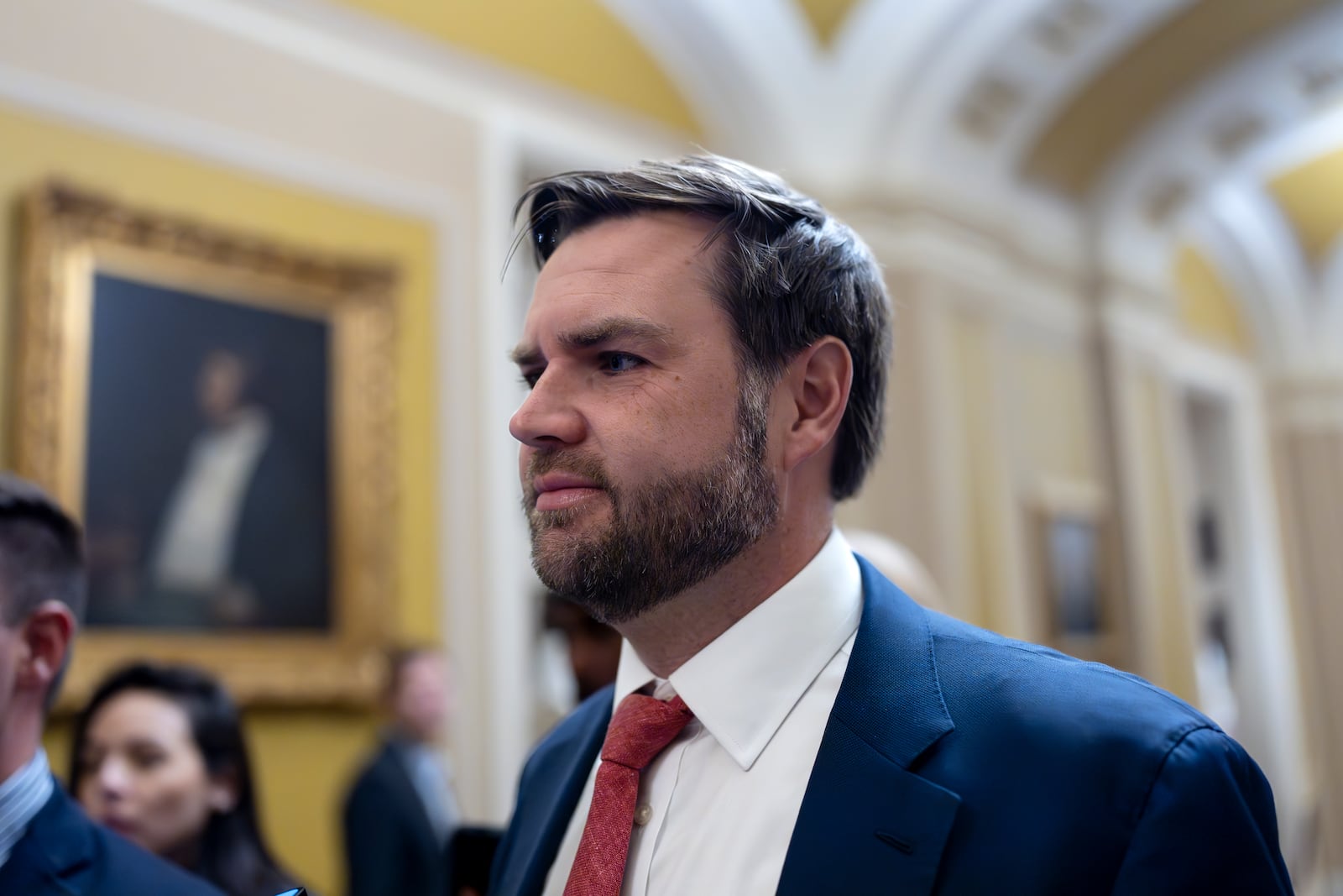 Sen. JD Vance, R-Ohio, the vice president-elect, leaves the Senate chamber as lawmakers work on an interim spending bill to avoid a shutdown of federal agencies, at the Capitol in Washington, Wednesday, Dec. 18, 2024. (AP Photo/J. Scott Applewhite)