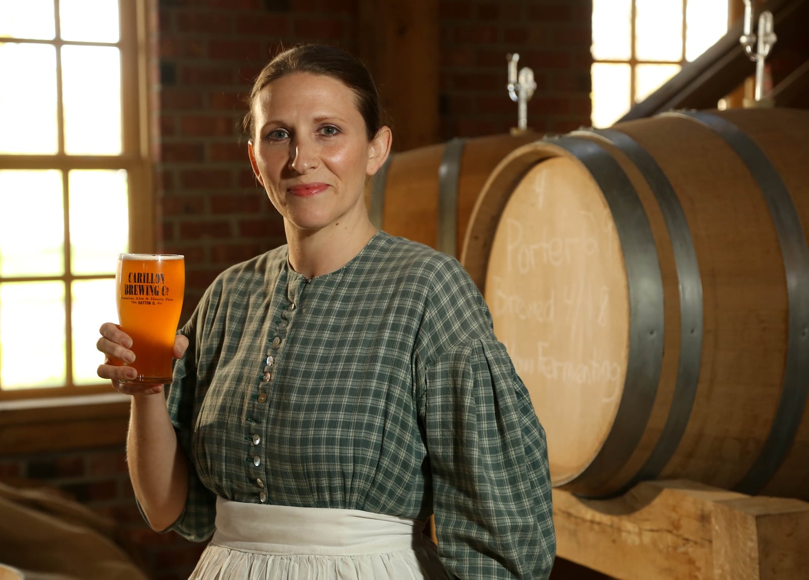 Tanya Brock, Brewmaster, Carillon Brewing Company in1850's era costume during brewery operations. The opening of the $3.5 million Carillon Brewery represents Dayton's strong history of brewing, and is a working brewhouse that produces a variety of ales as well as serving other brands of craft beer. It is the only one of its' kind in the country. A dozen new craft breweries of varying sizes and concepts have opened their doors in the greater Dayton area where none existed just three years ago. JIM WITMER/STAFF