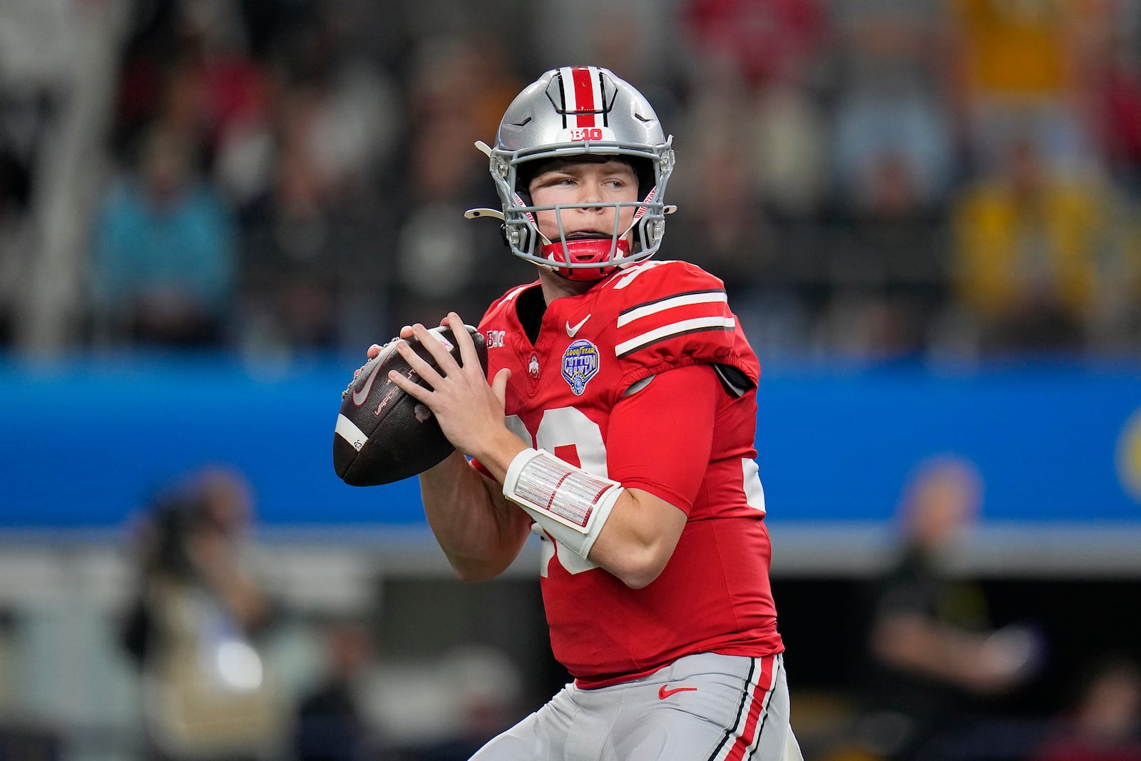 FILE - Ohio State quarterback Devin Brown passes against Missouri during the first half of the Cotton Bowl NCAA college football game Friday, Dec. 29, 2023, in Arlington, Texas. Will Howard and Brown are among five player seeking the starting quarterback role at Ohio State as spring practice opened Tuesday, March 5, 2024. (AP Photo/Julio Cortez, File)